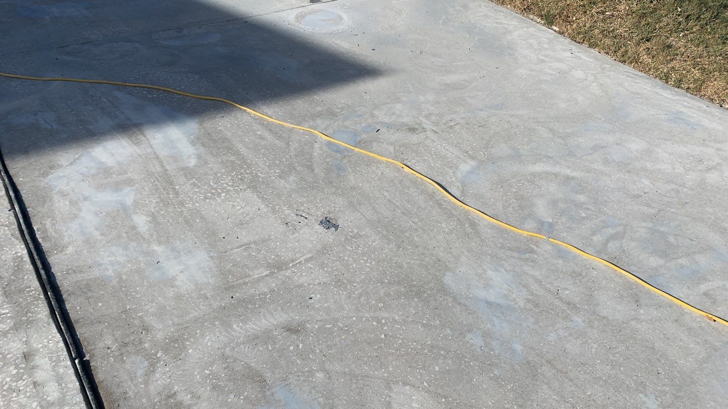 Driveway using Slate Stone by Select Painting, Coatings & Garage Cabinets