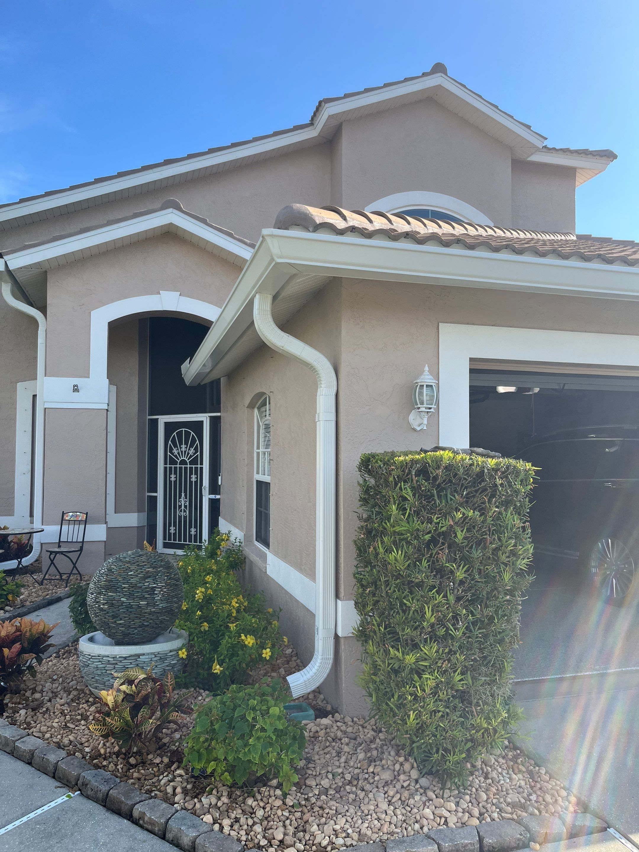 Replace White Seamless Gutters Installation in Sarasota FL by Gutter Professors