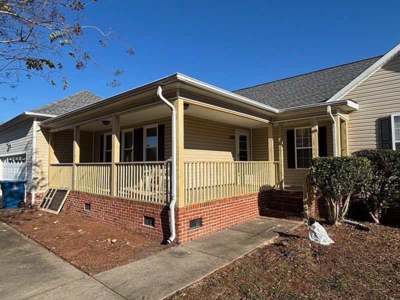 Custom Screened Porch Conversion with New Wood Railing in Dunn by The Remodeling Company