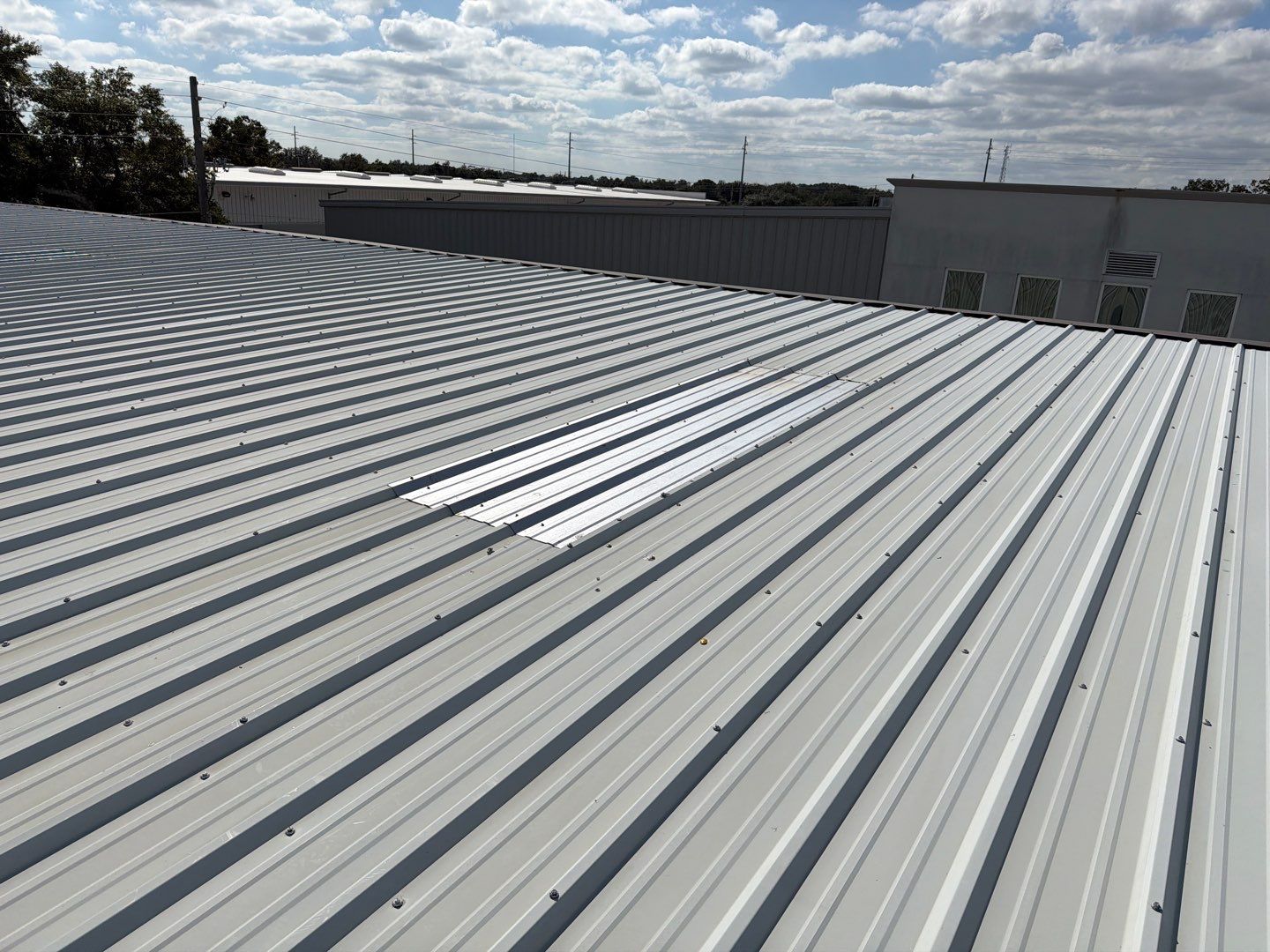 Orlando Commercial Metal Roof Restoration and Silicone Coating System by CES Roofing