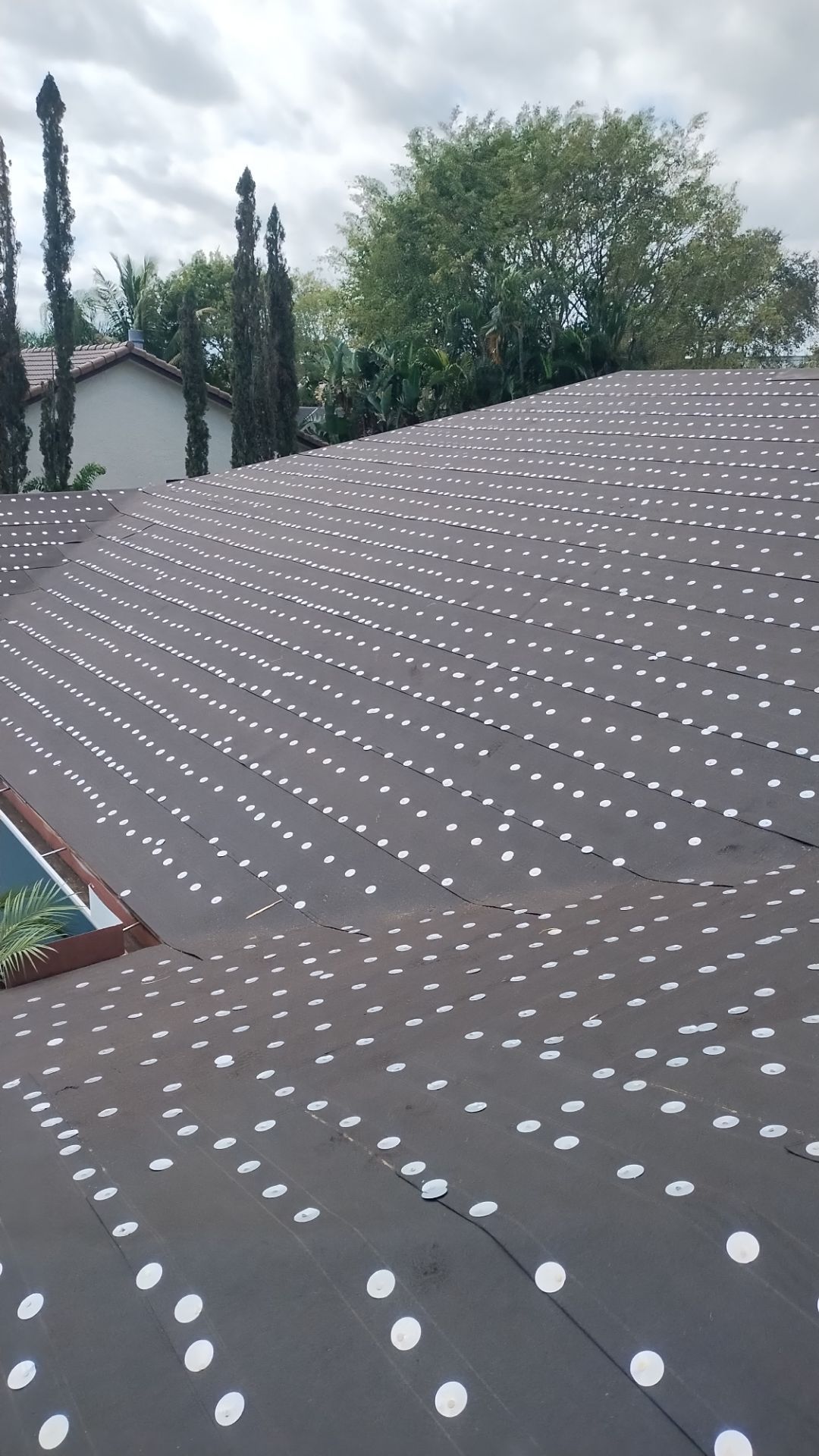 Residential Roofing Installation using 1" Nail strip metal roof by BLUES BROTHERS CONSTRUCTION CORP