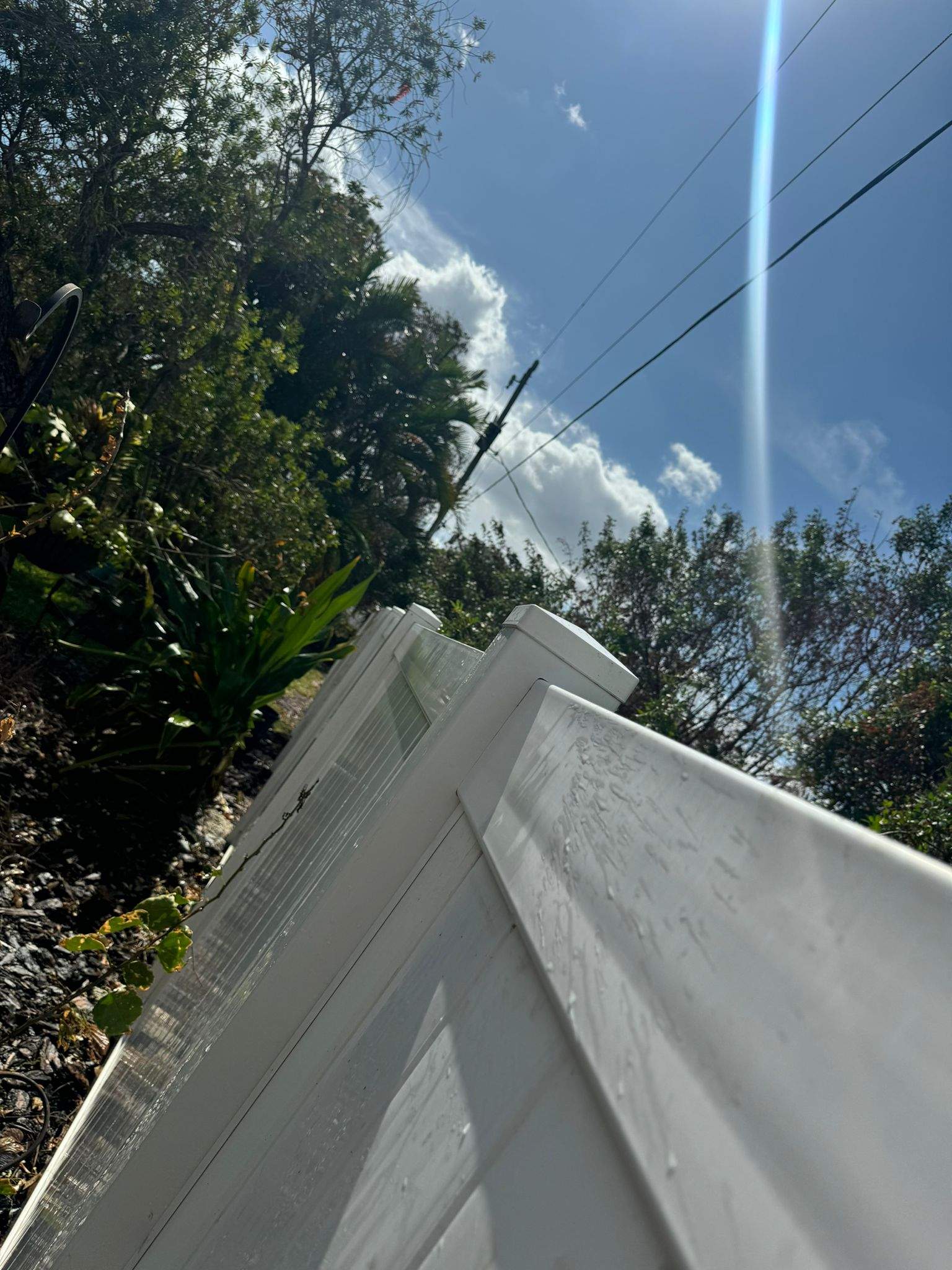 White Vinyl Privacy Fence Installation in Port Charlotte by True Fence LLC