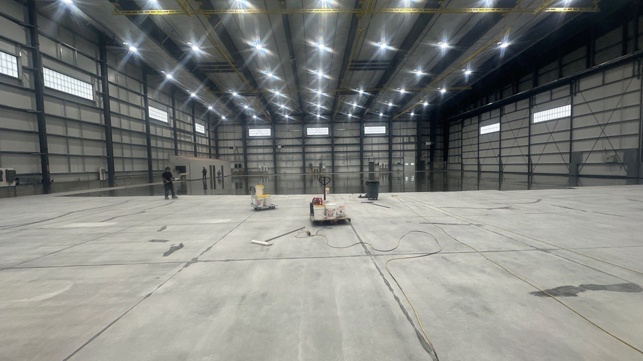 Airplane Hanger using Light Grey Commercial Penntek Epoxy by Croc Coatings, LLC