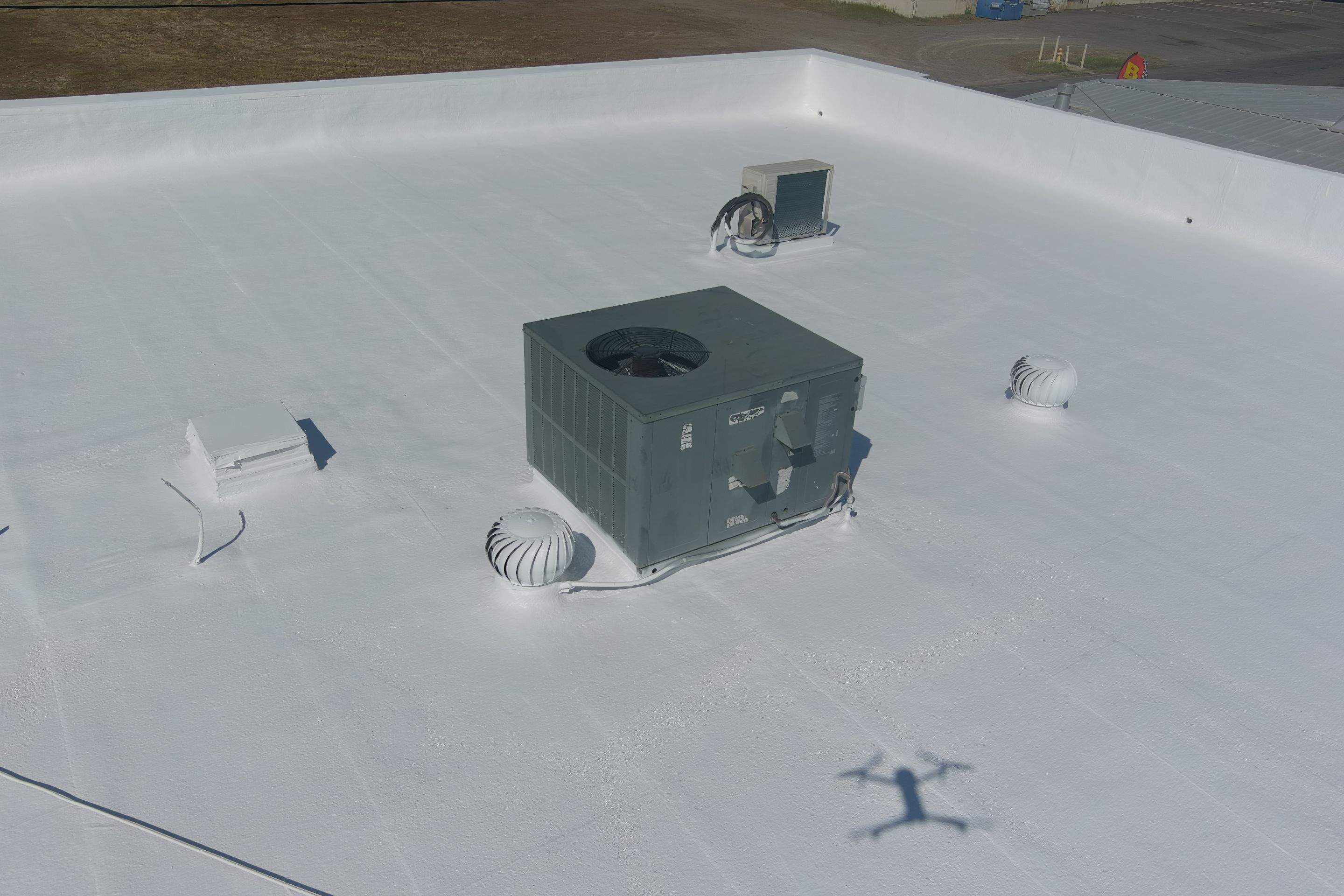 Spray foam and coatings using Conklin Benchmark/PUMA XL coatings and spray foam by Straight Edge Roofing Inc