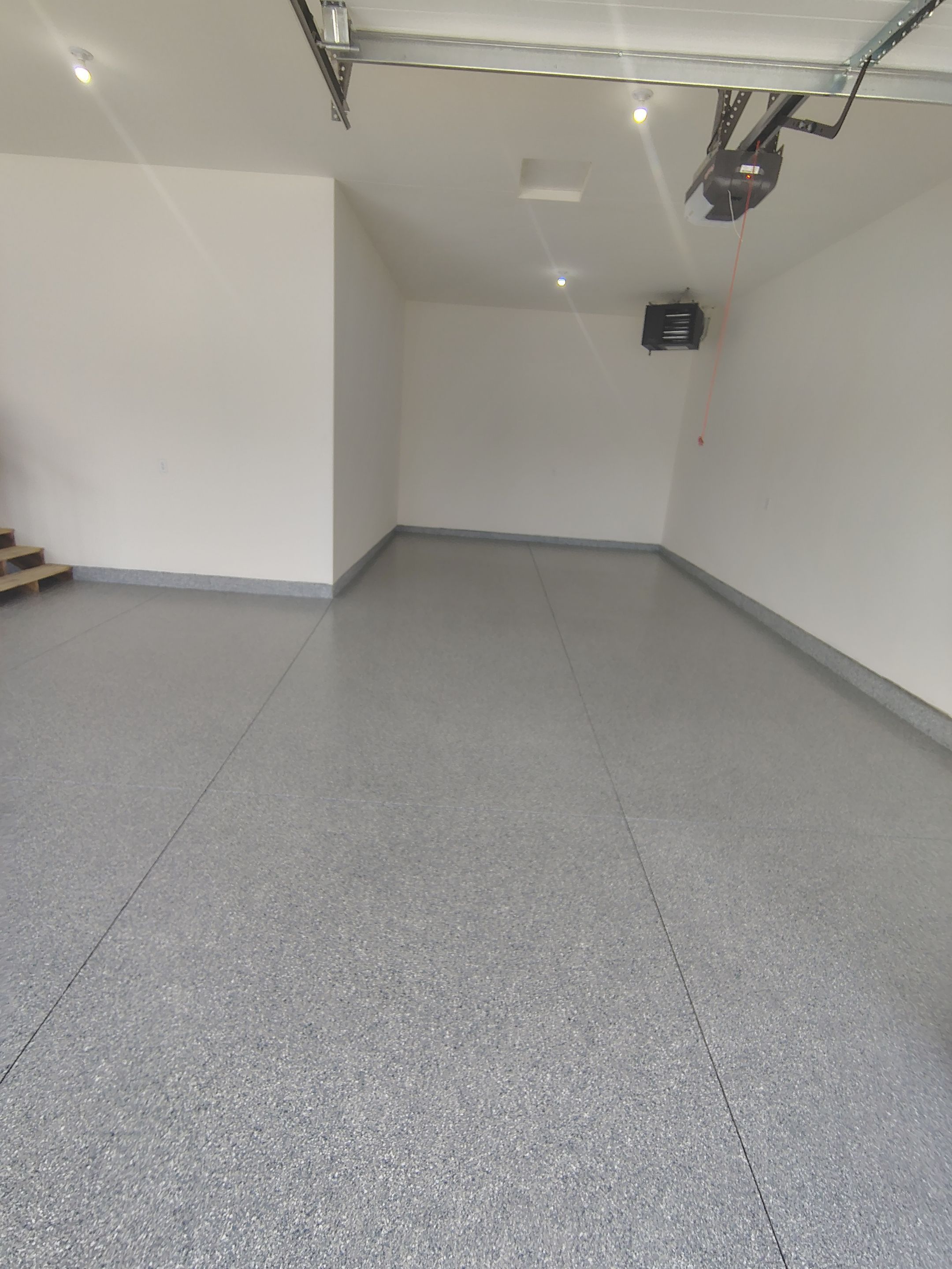 Sioux Falls Garage Floor Transformation with Gray Decorative Flake Coating by Select Painting, Coatings & Garage Cabinets
