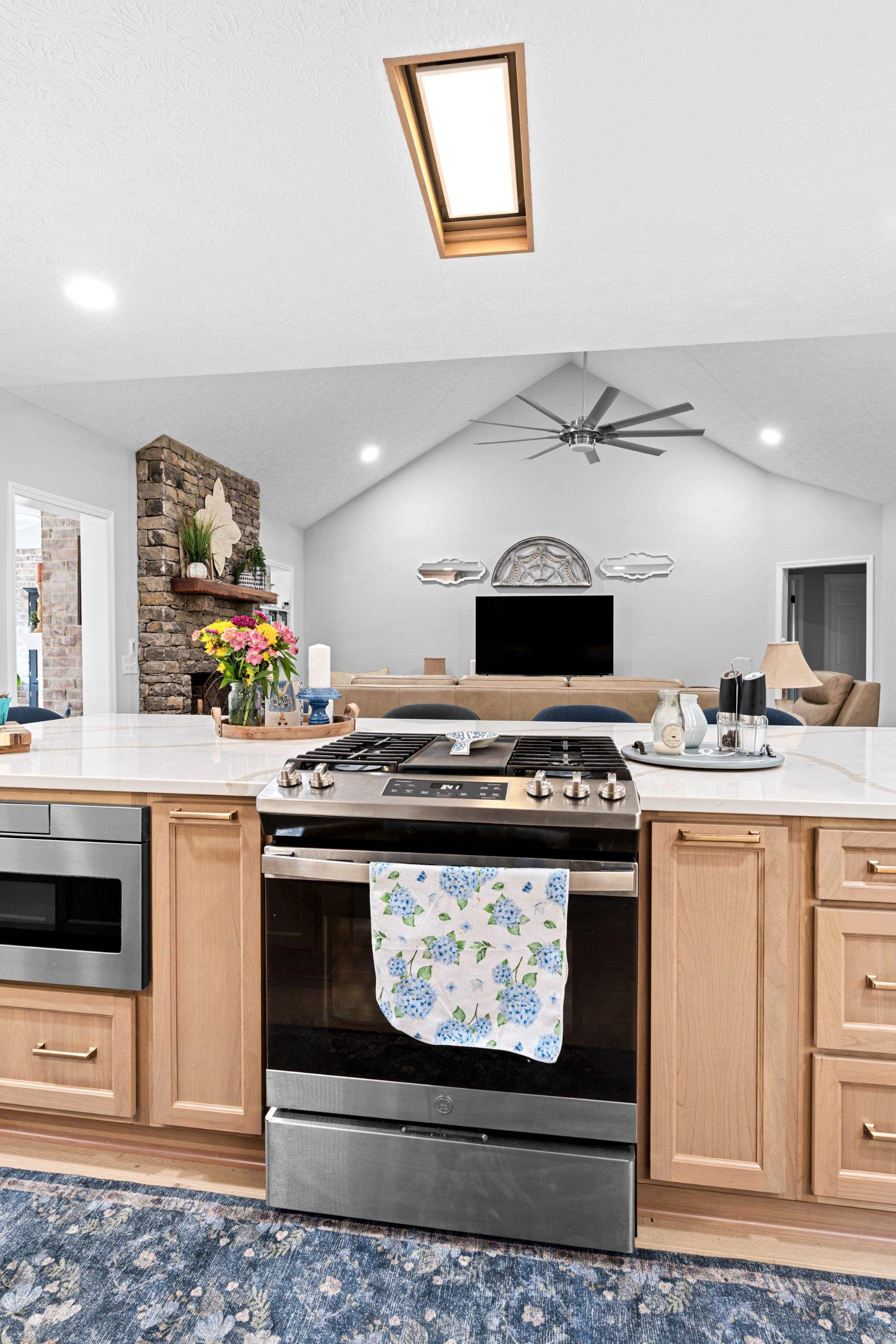 Modern Kitchen Remodel Featuring Quartz Backsplash, under cabinet lighintg, and a coffee bar in Mt. Juliet Tennessee by DeRo Renovations,LLC