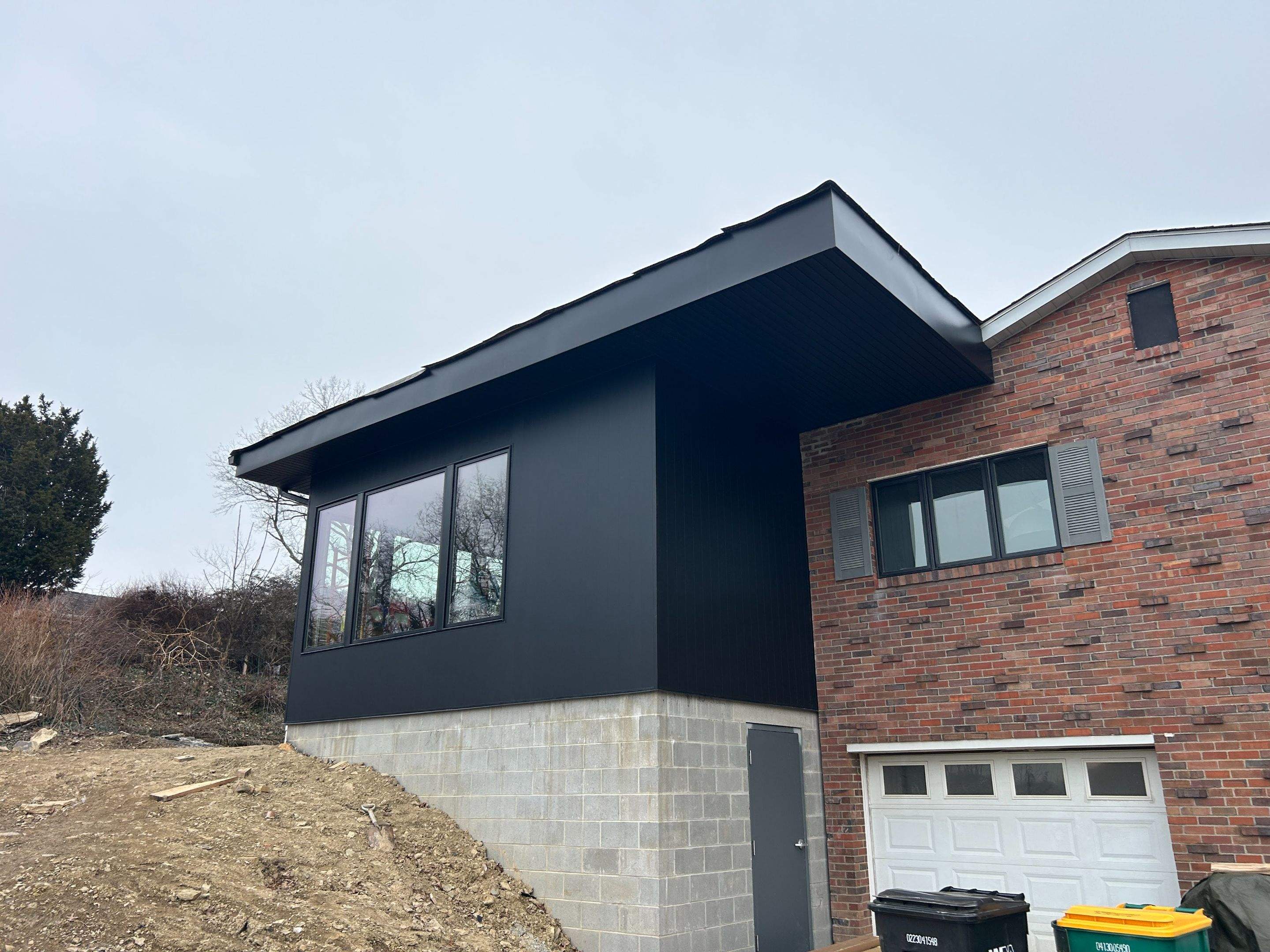 Modern Home Addition with Matte Black Siding in Pittsburgh by Ideal Siding Pittsburgh