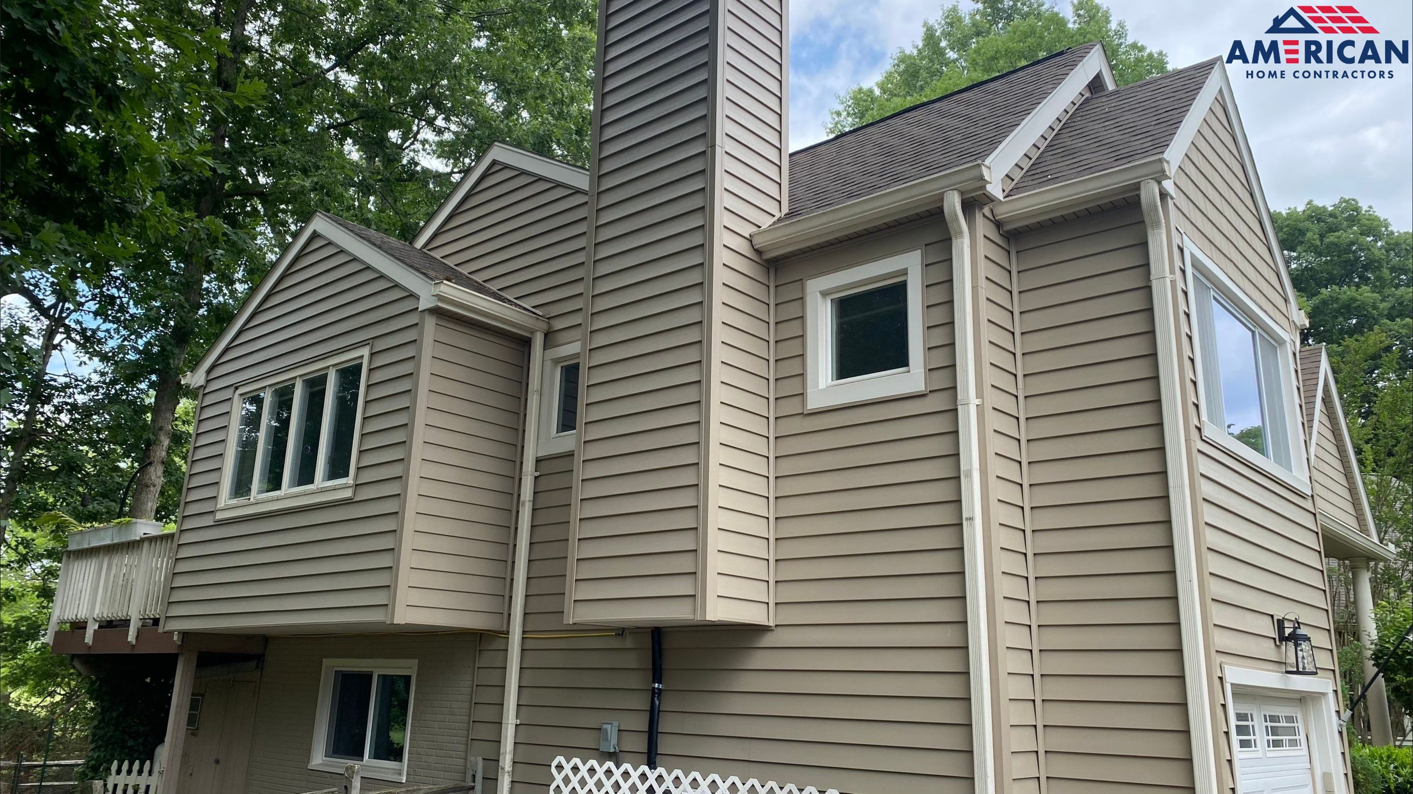 Mastic Siding + Interstate Windows by American Home Contractors