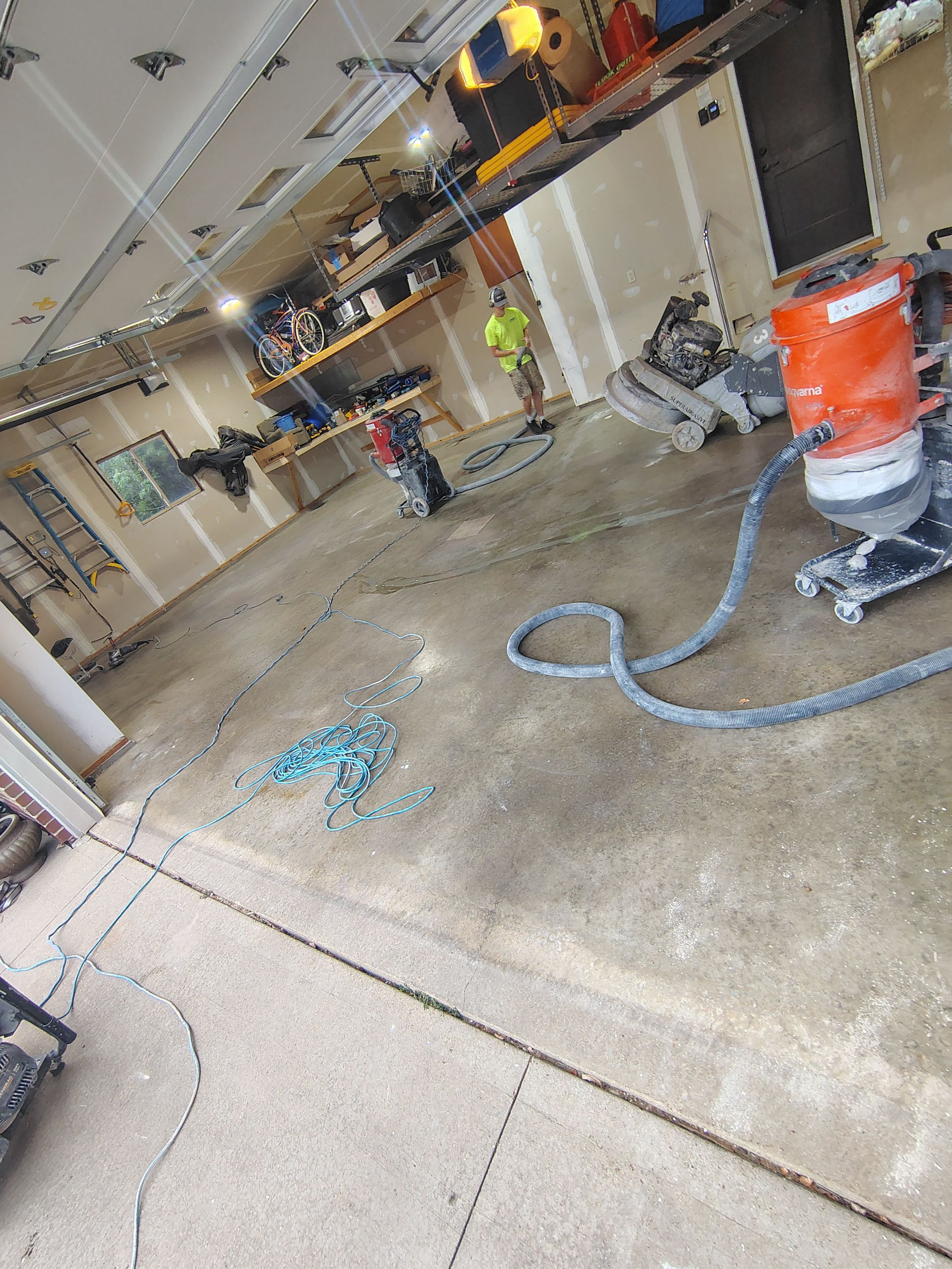 Sioux Falls Garage Concrete Grinding and Nightfall Decorative Chip Coating by Select Painting, Coatings & Garage Cabinets