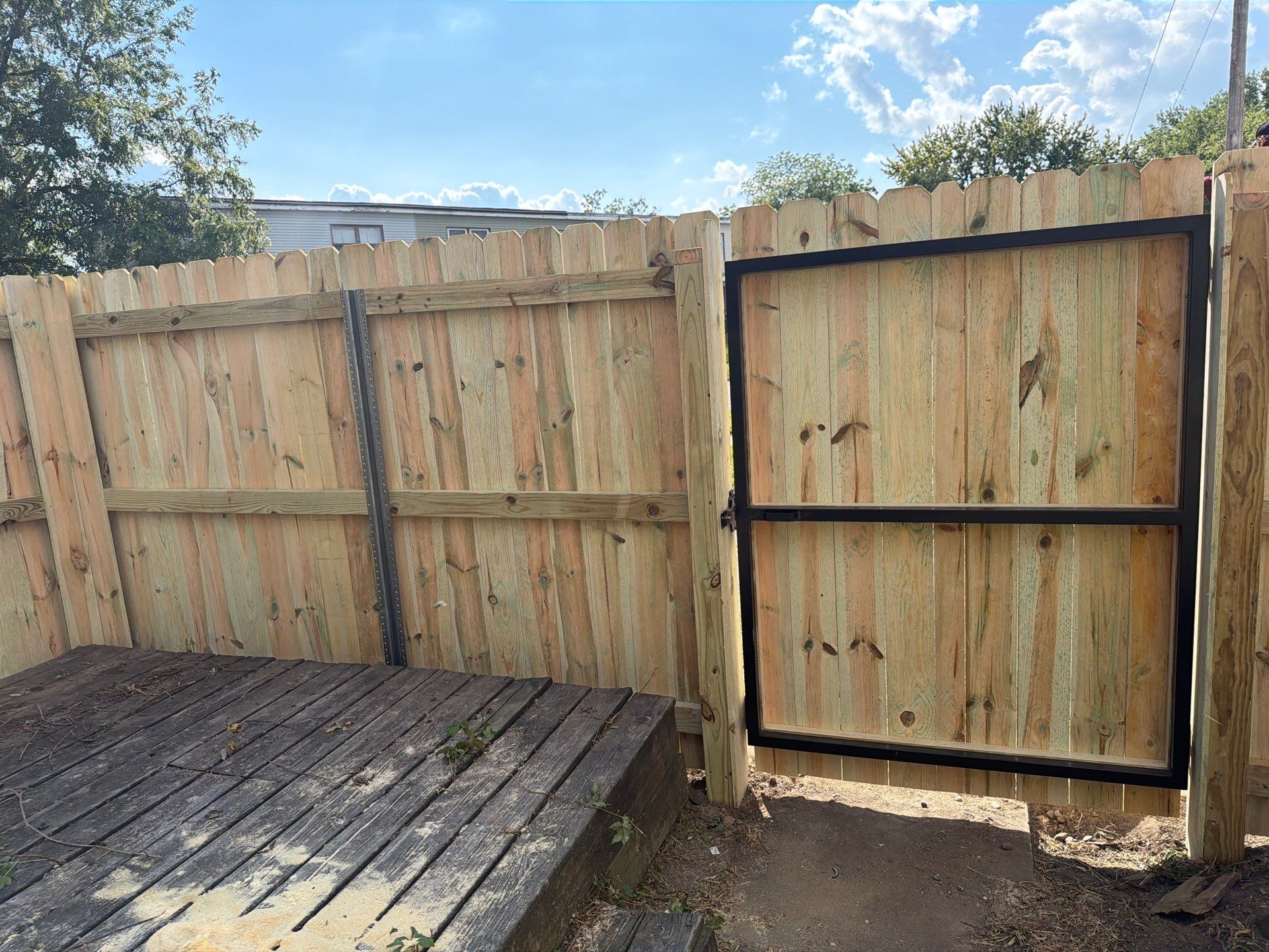 New Treated Wood Privacy Fence and Metal-Framed Gates by Perfect Picket Fence and Stain