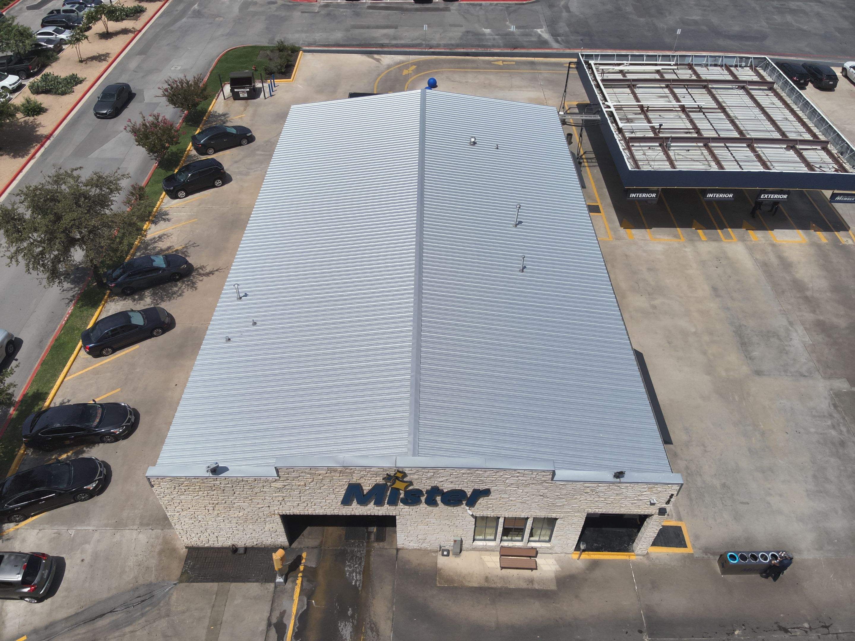 Commercial Roofing Installation using Metal Standing Seam U Panel by Action Exteriors Austin