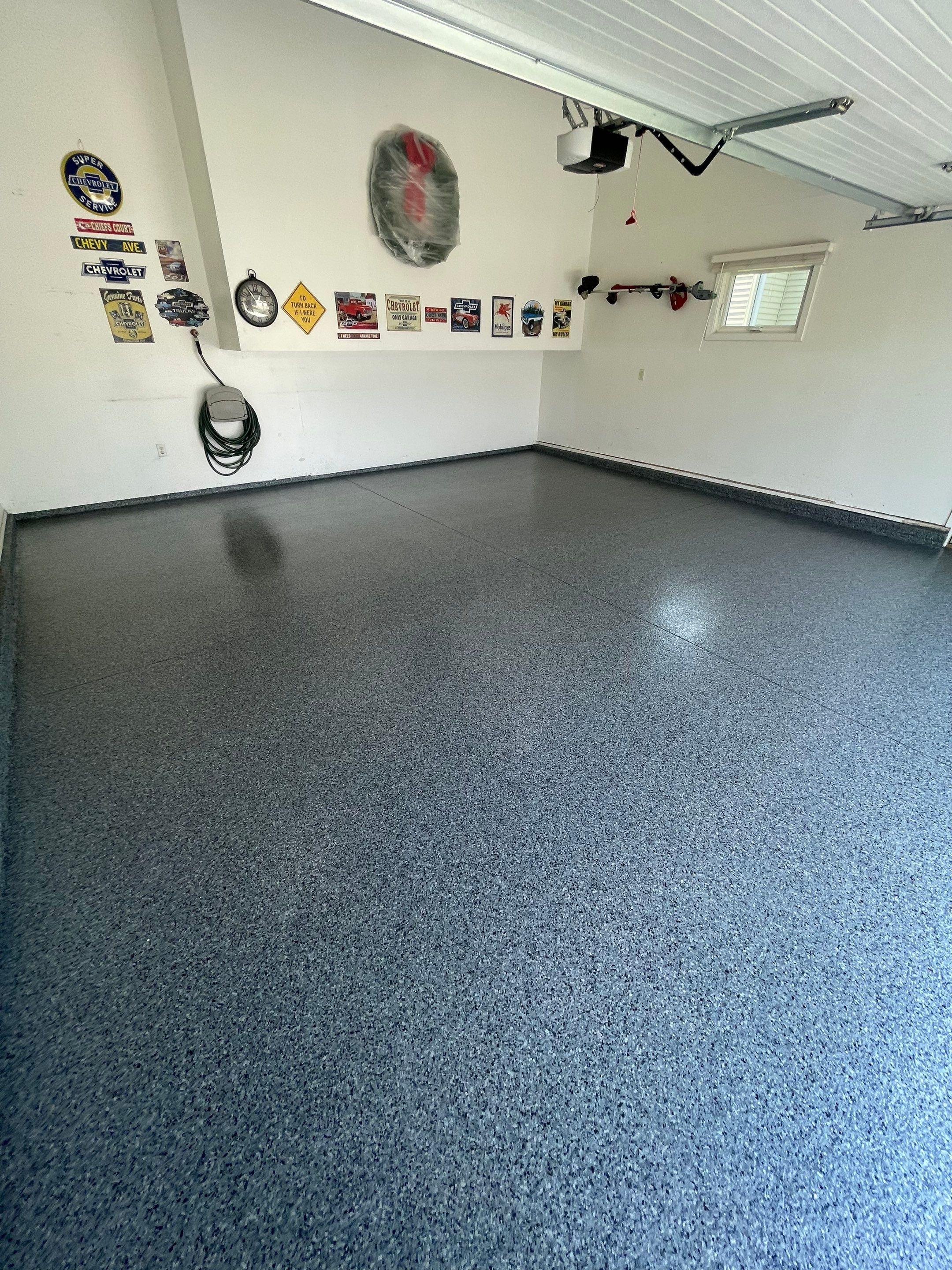 Sioux Falls Garage Floor Coating with Nightfall Decorative Chips by Select Painting, Coatings & Garage Cabinets