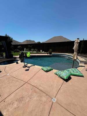 Freeform Pool with Raised Spa and Stone Veneer