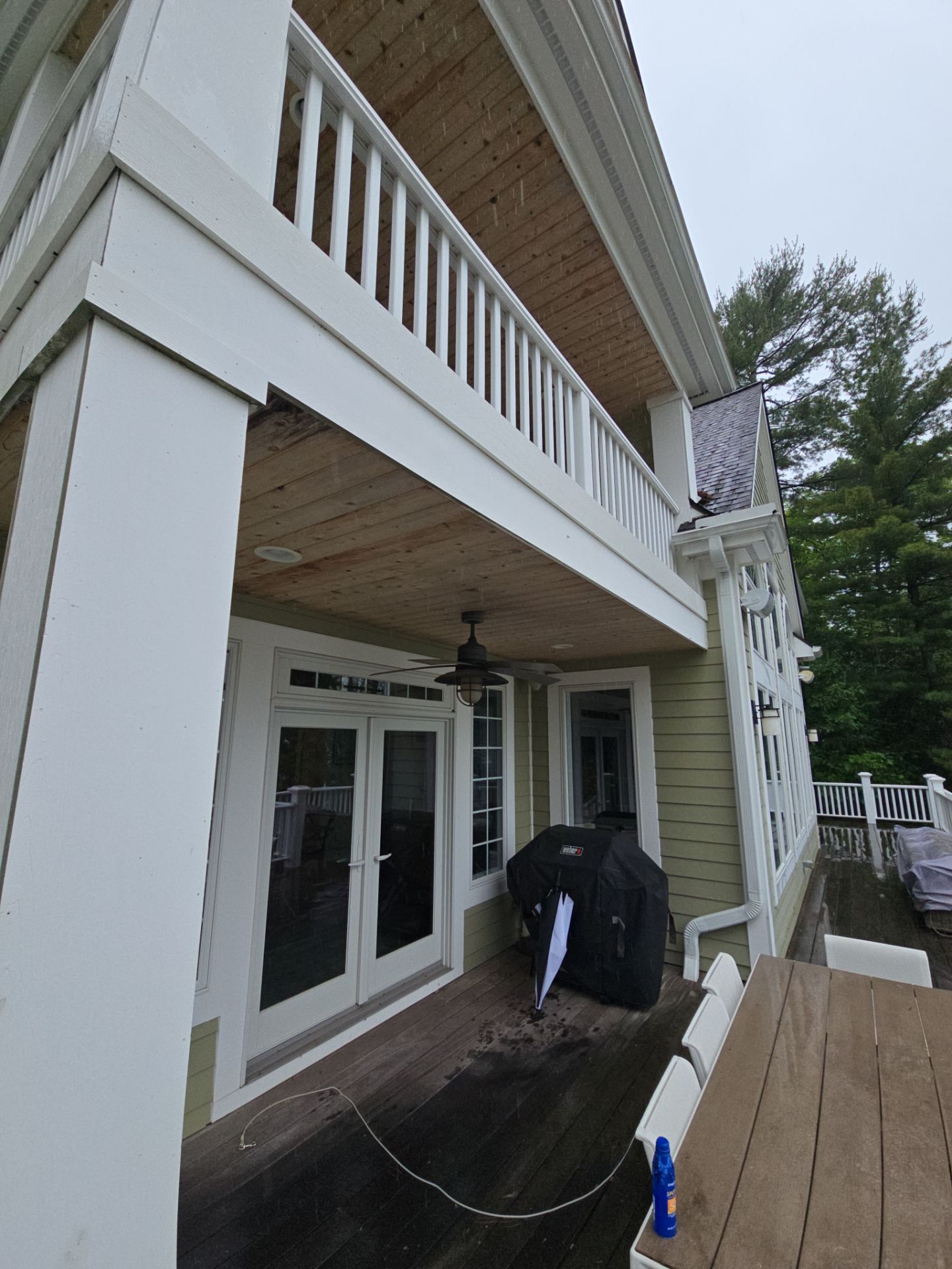 Sunesta Retractable Awning Installation for Lakeside Deck in Kewadin by Rainbow Seamless Systems