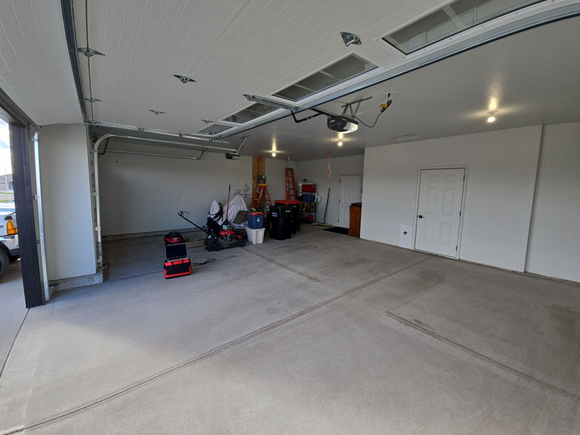 High-Gloss Epoxy Flake Garage Floor Coating in Brandon by Select Painting, Coatings & Garage Cabinets