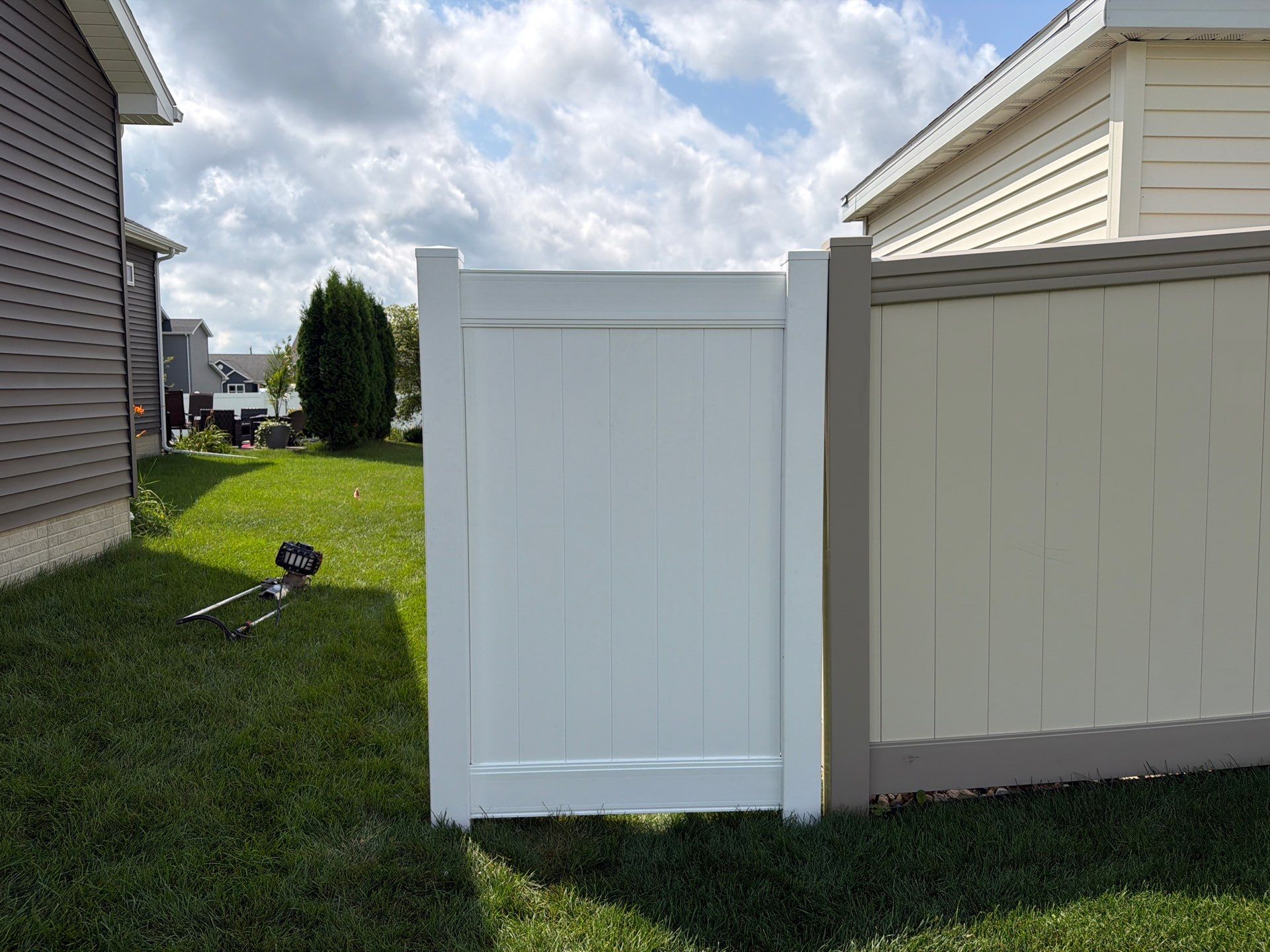 New Vinyl Privacy Fencing and Gates for Waterloo Residential Backyard by Perfect Picket Fence and Stain