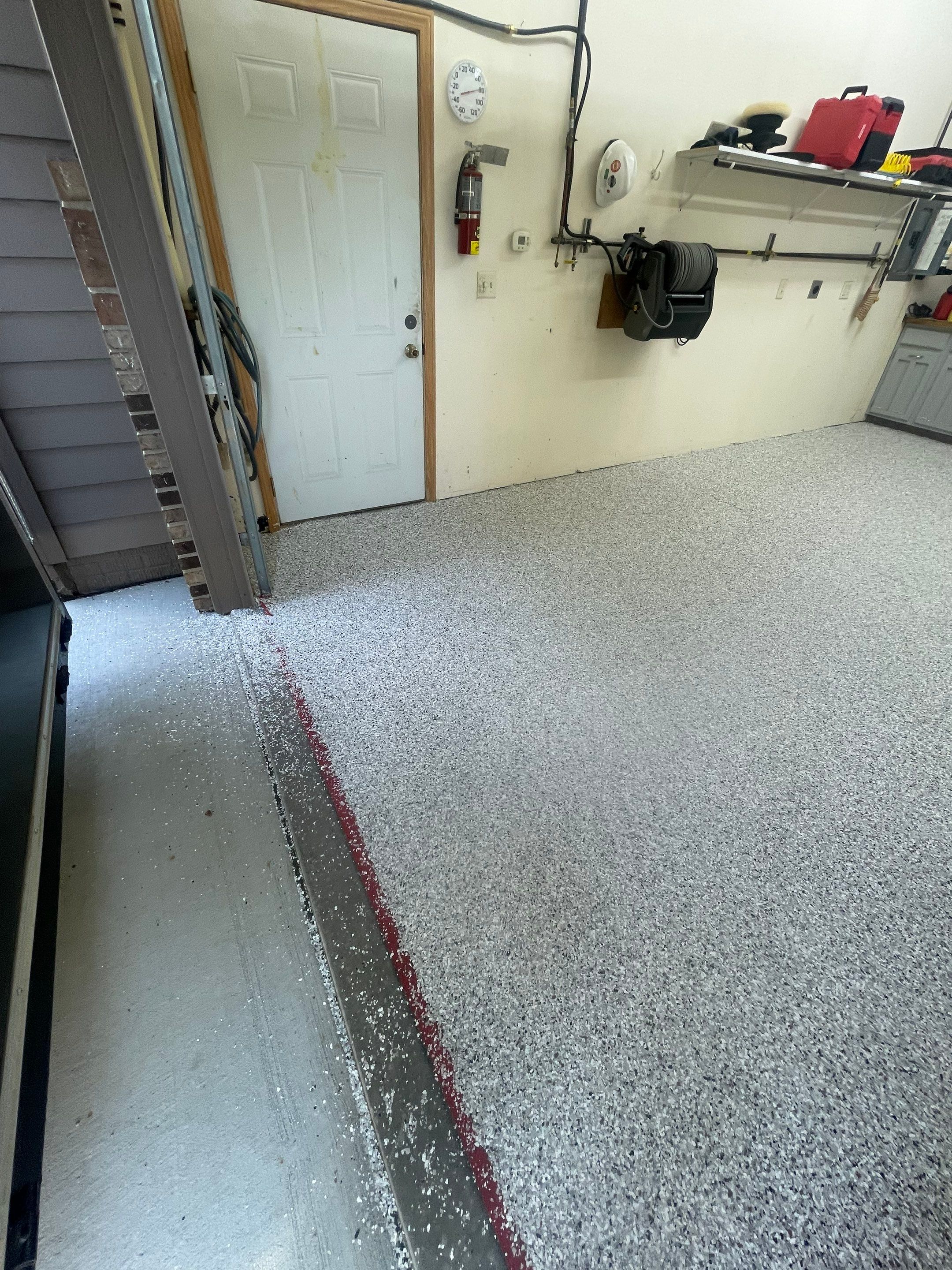 Multi-Stall Garage Floor Coating Installation in Sioux Falls by Select Painting, Coatings & Garage Cabinets