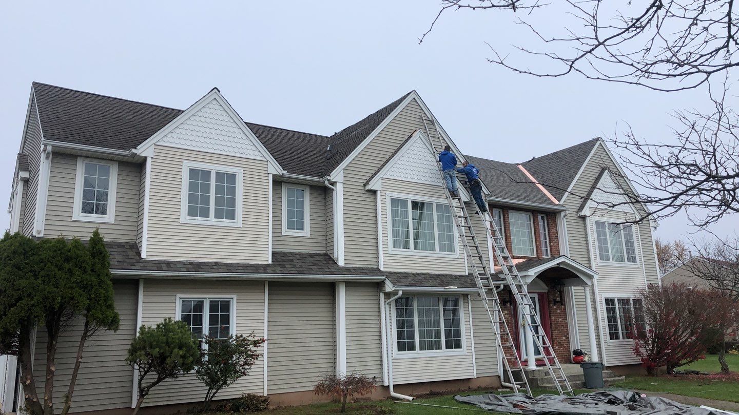 Commercial Roofing Installation using Owens Corning TruDefinition driftwood by A Plus Exterior