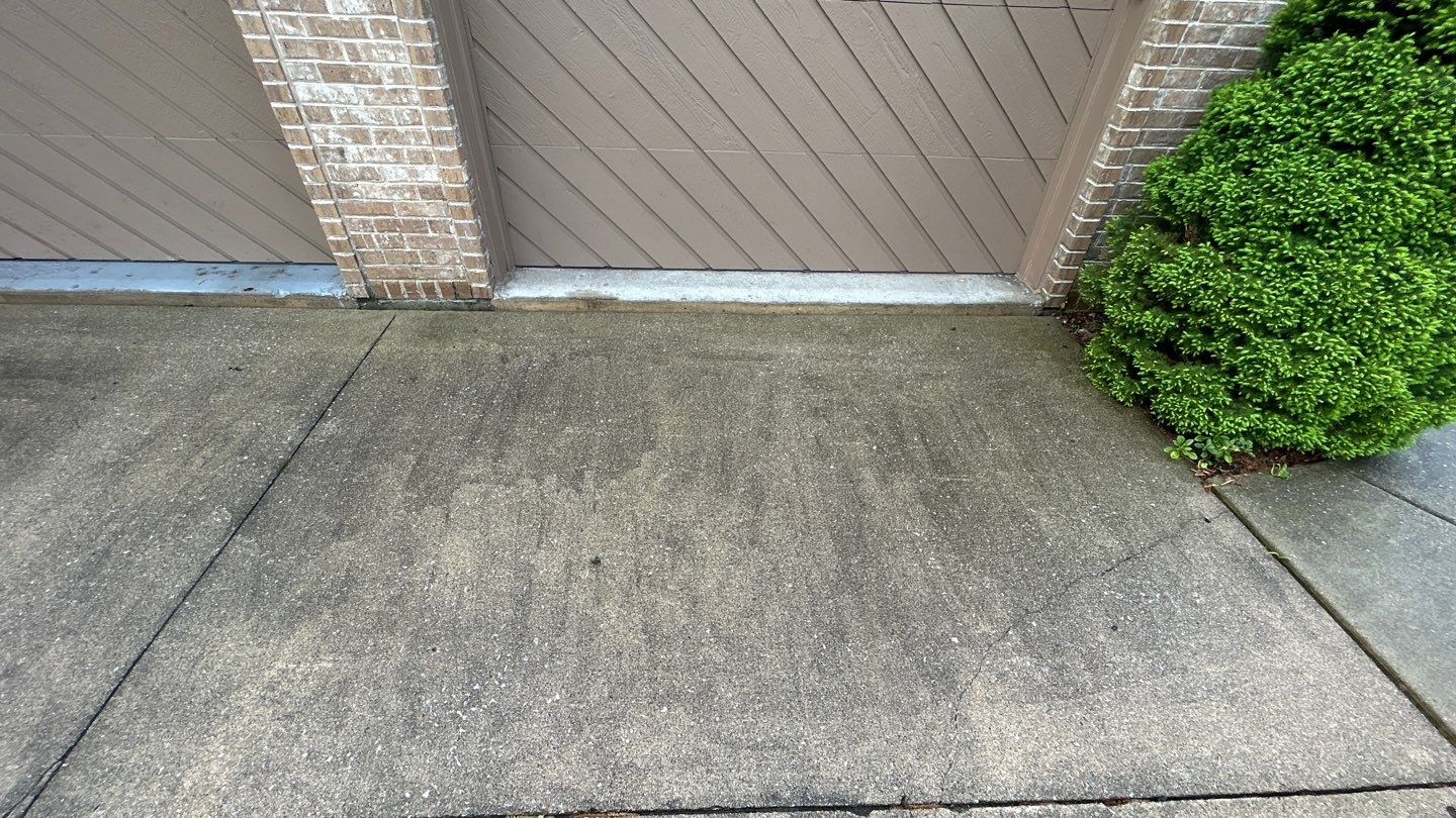 concrete patio and driveway cleaning by Northern Power Washing LLC.