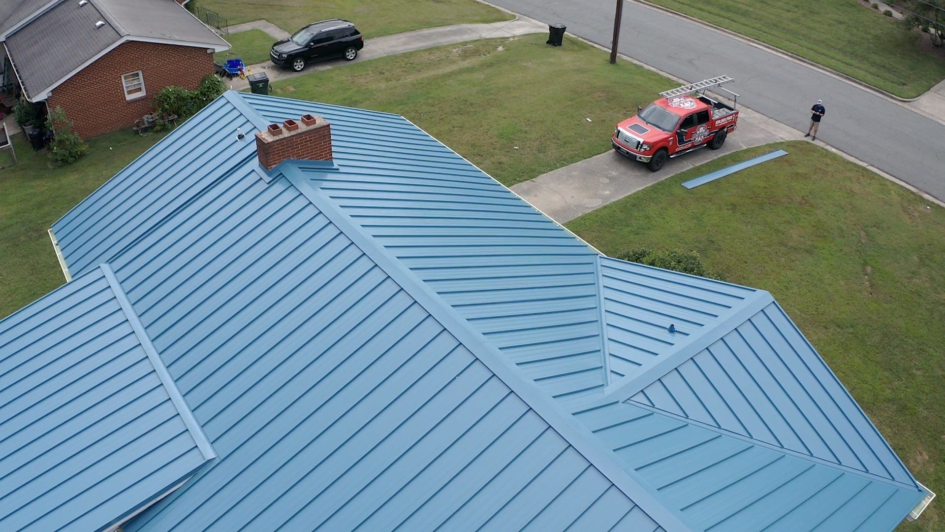 Carolina Blue Standing Seam Roof by Just In Time Roofing and Restoration