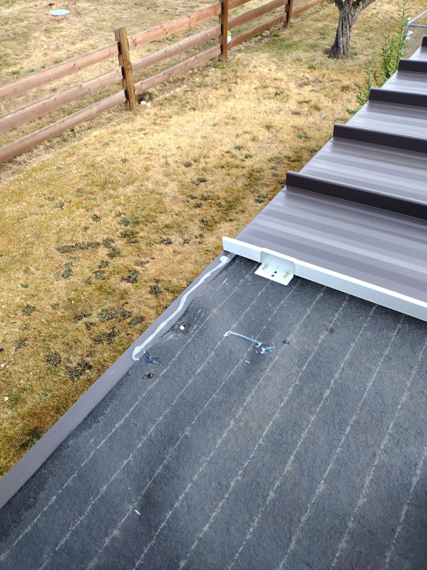 Residential Roof Replacement with Metal Accents by Orezona Building & Roofing Company, Inc.
