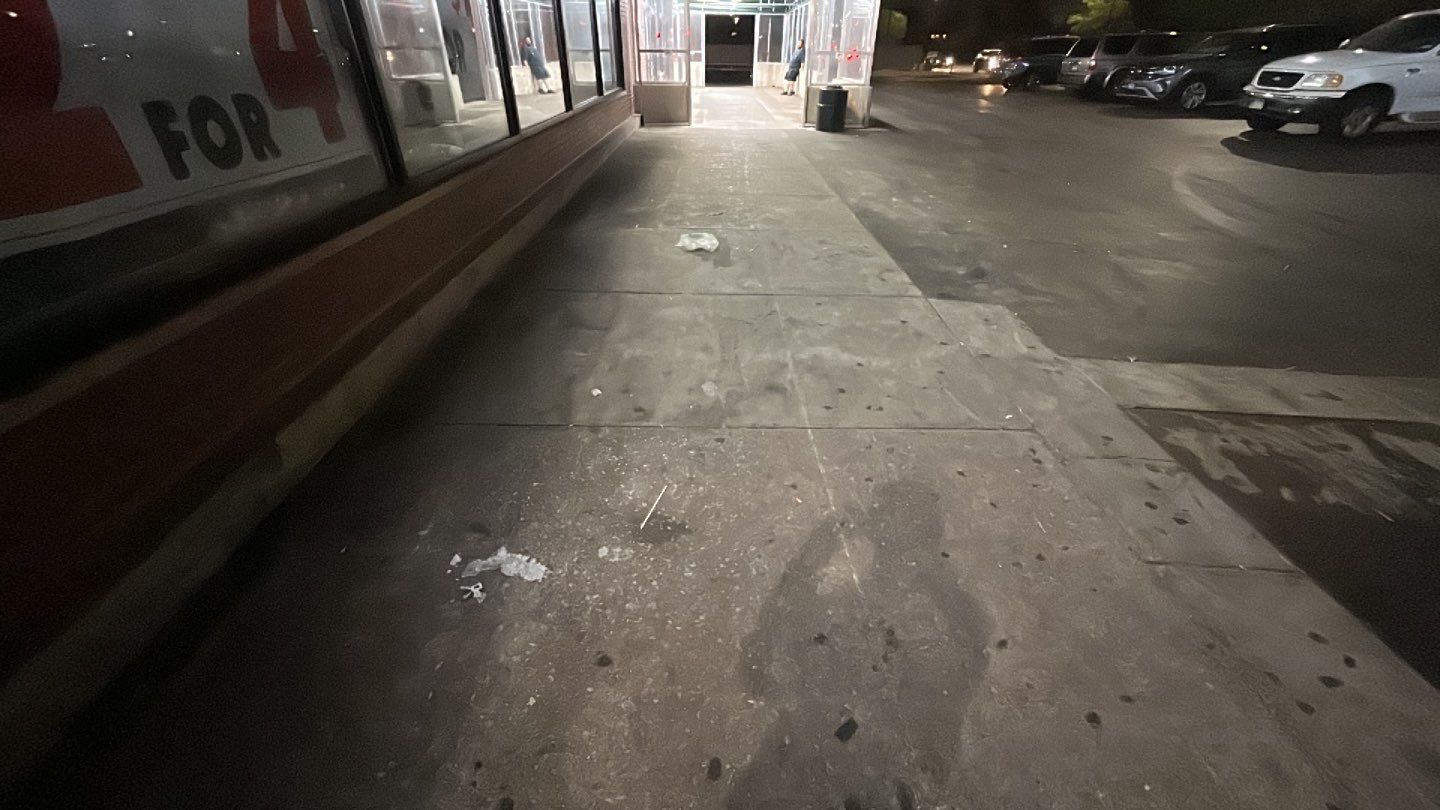 Concrete sidewalk cleaning and degreasing by Northern Power Washing LLC.