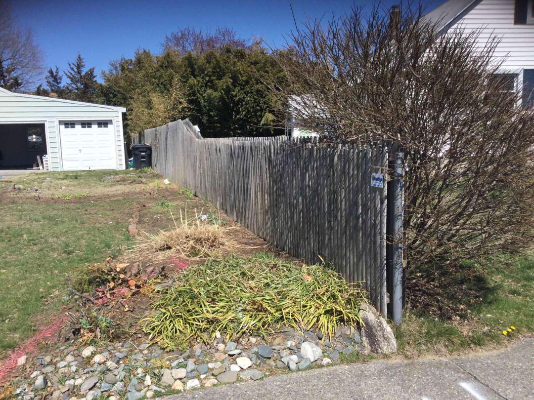 Replacement Vinyl Privacy fence with Transition piece in White by DiGiorgi Roofing and Siding Inc