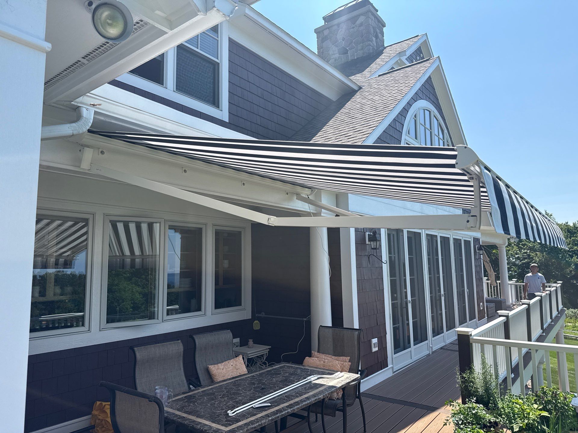 Sunesta Retractable Awning Installation in Harbor Springs by Rainbow Seamless Systems