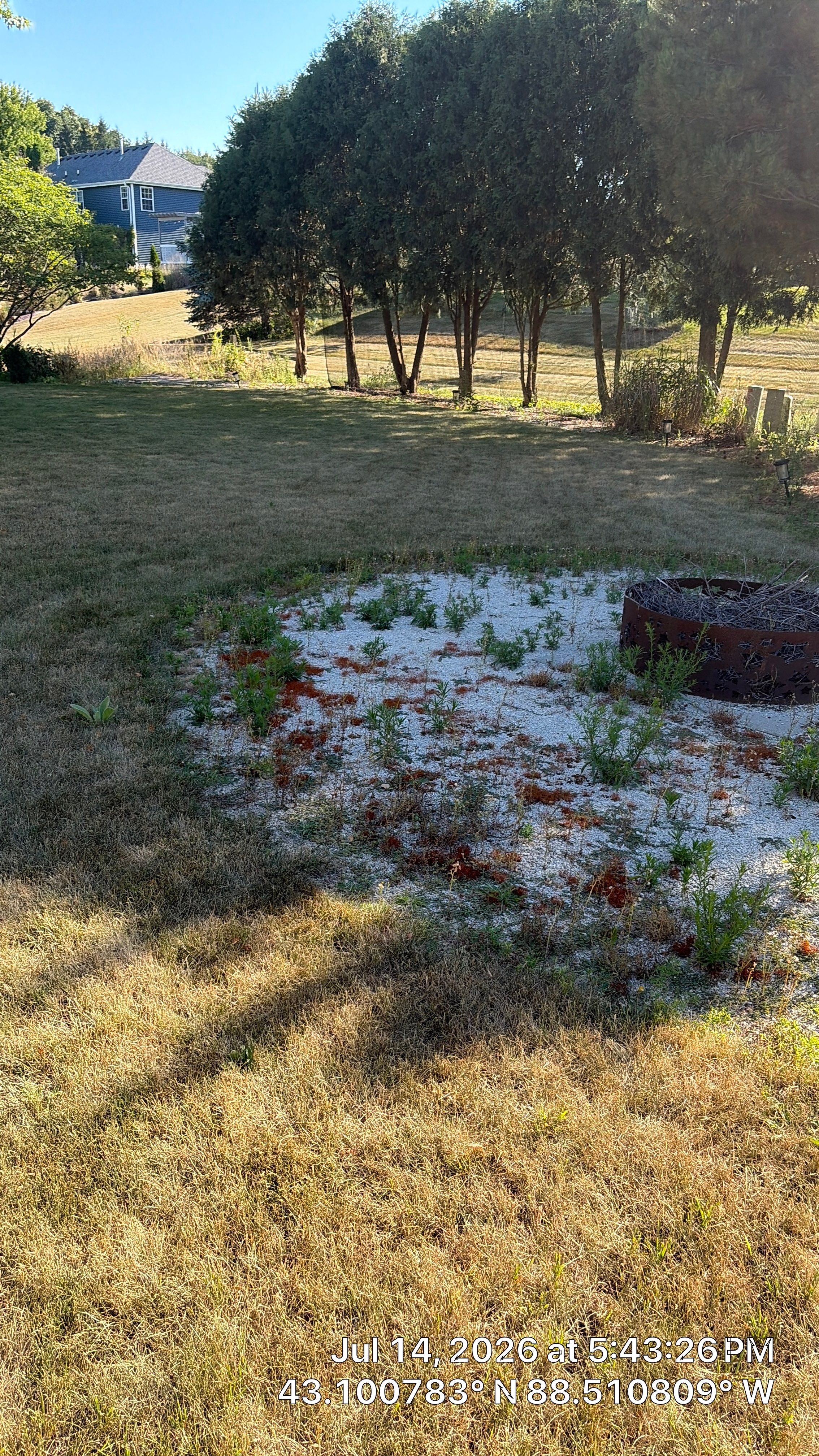 Decorative Stone and River Rock Landscaping for Oconomowoc Residence by CompanyCam Sales Demo