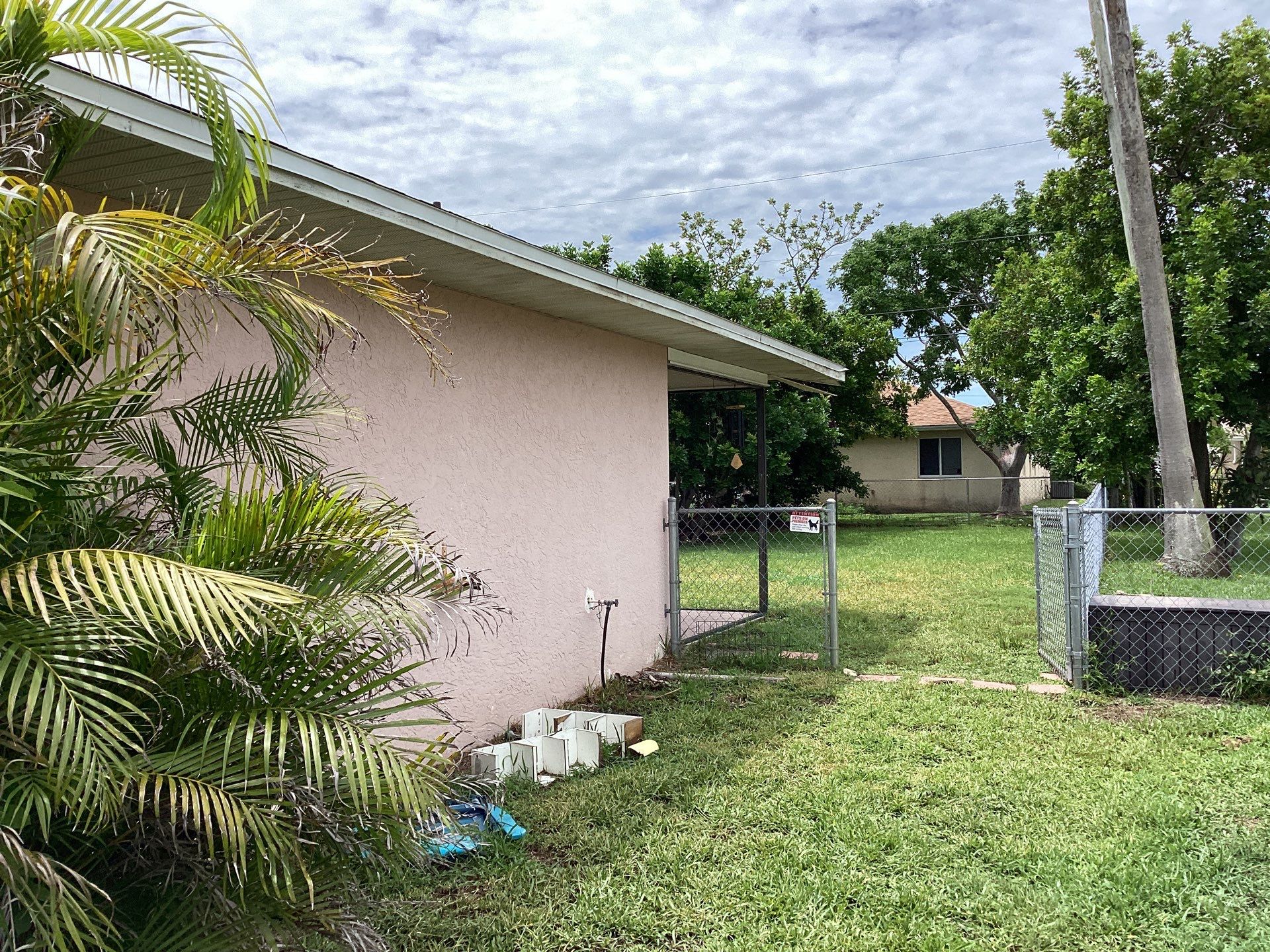 Replace gutter using White Down Spouts in Cape Coral FL by Gutter Professors