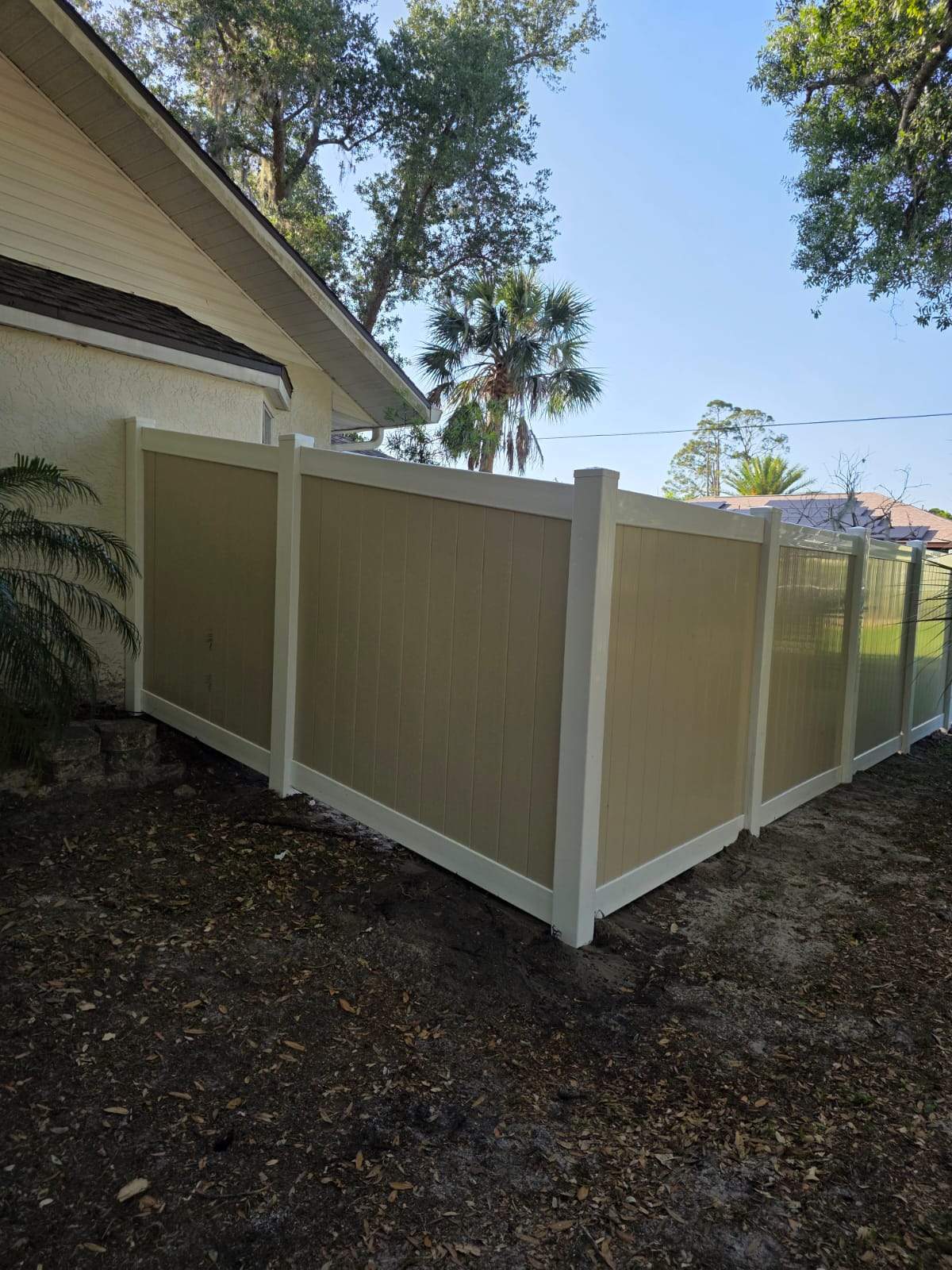 Two-Tone Vinyl Privacy Fence Installation in Port Charlotte by True Fence LLC