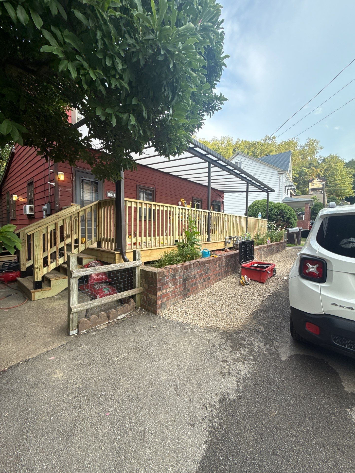 Roof sunspace deck  by Cousins Roofing Siding & Decks