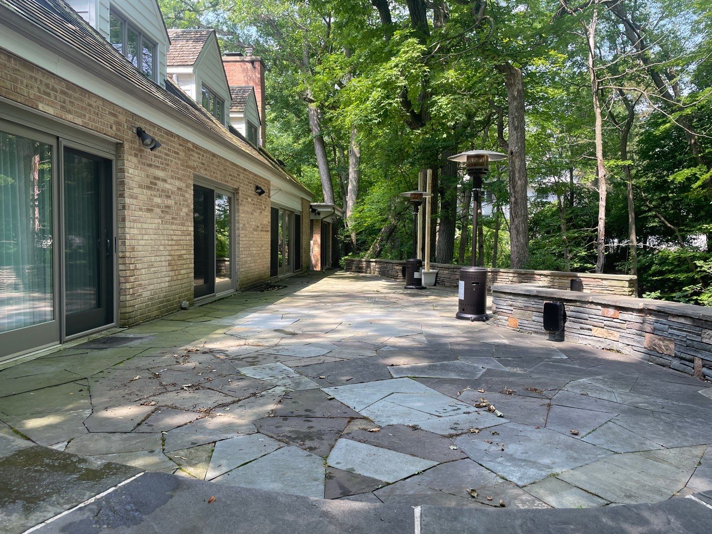 Bluestone patio cleaning by Northern Power Washing LLC.
