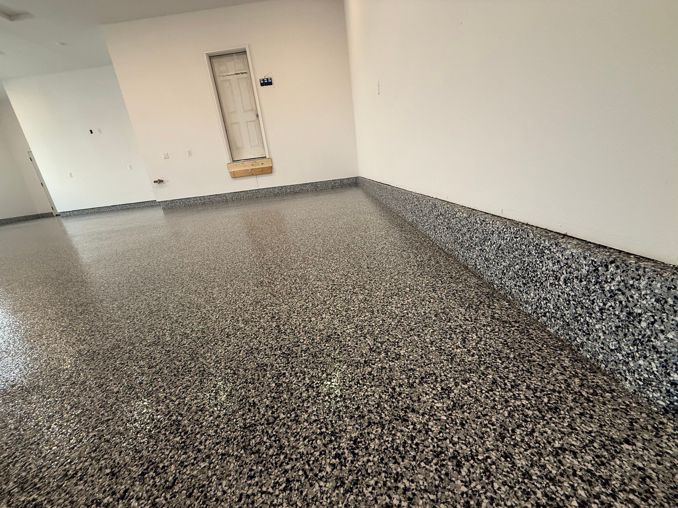 Multi-Car Garage Epoxy Floor Coating and Concrete Finishing in Sioux Falls by Select Painting, Coatings & Garage Cabinets