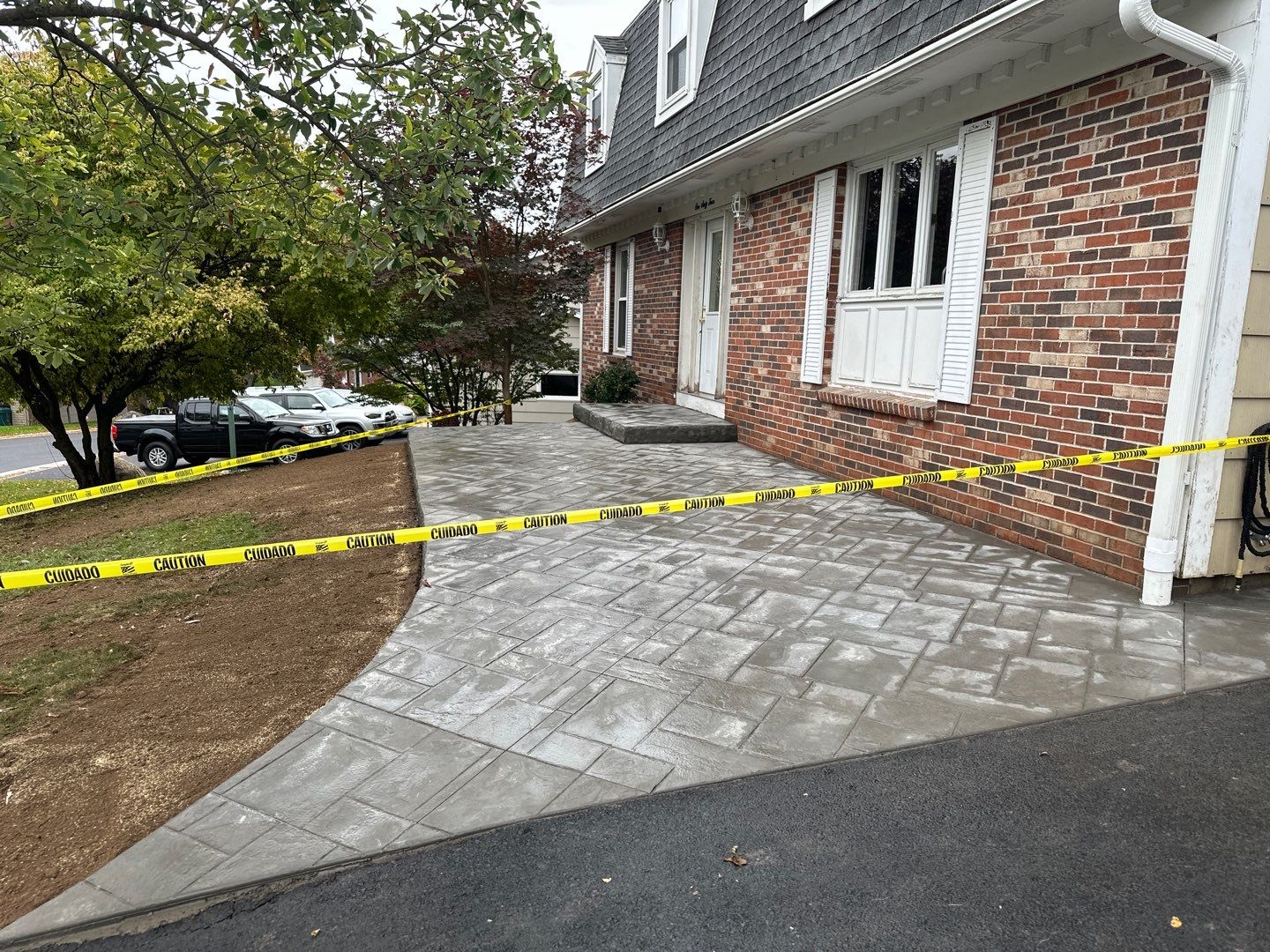 Ashlar slate stamped concrete patio  by NG Masonry & Construction LLC