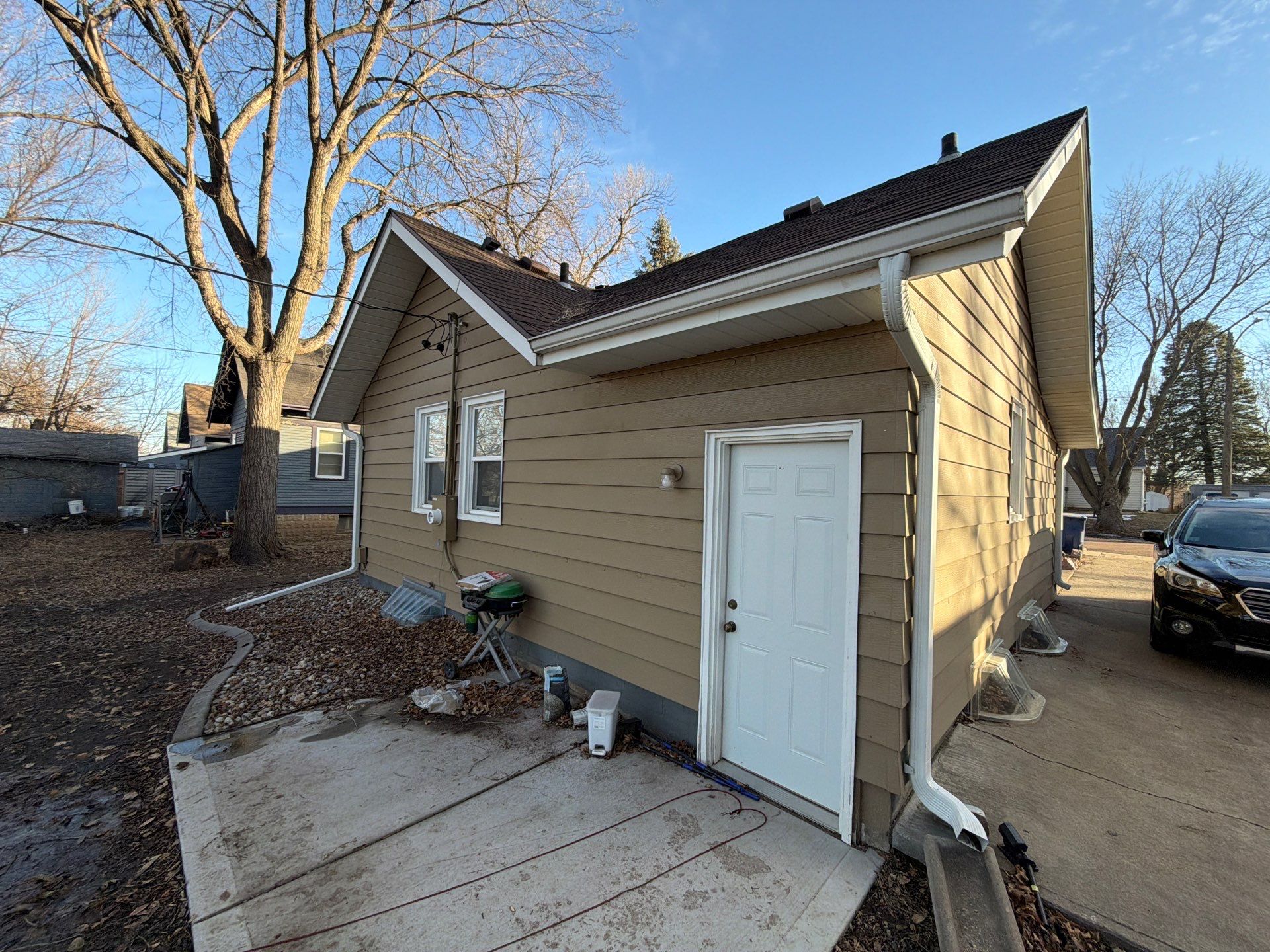 Exterior Siding Repair and Full House Repaint in Sioux Falls by Select Painting, Coatings & Garage Cabinets