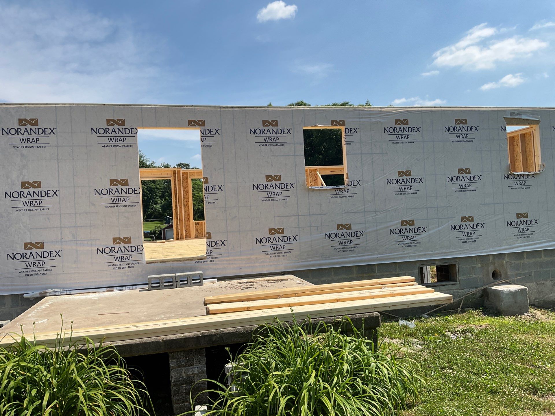 New Residential Addition with Blue Siding and Metal Roofing in Ashland by Esh Builders