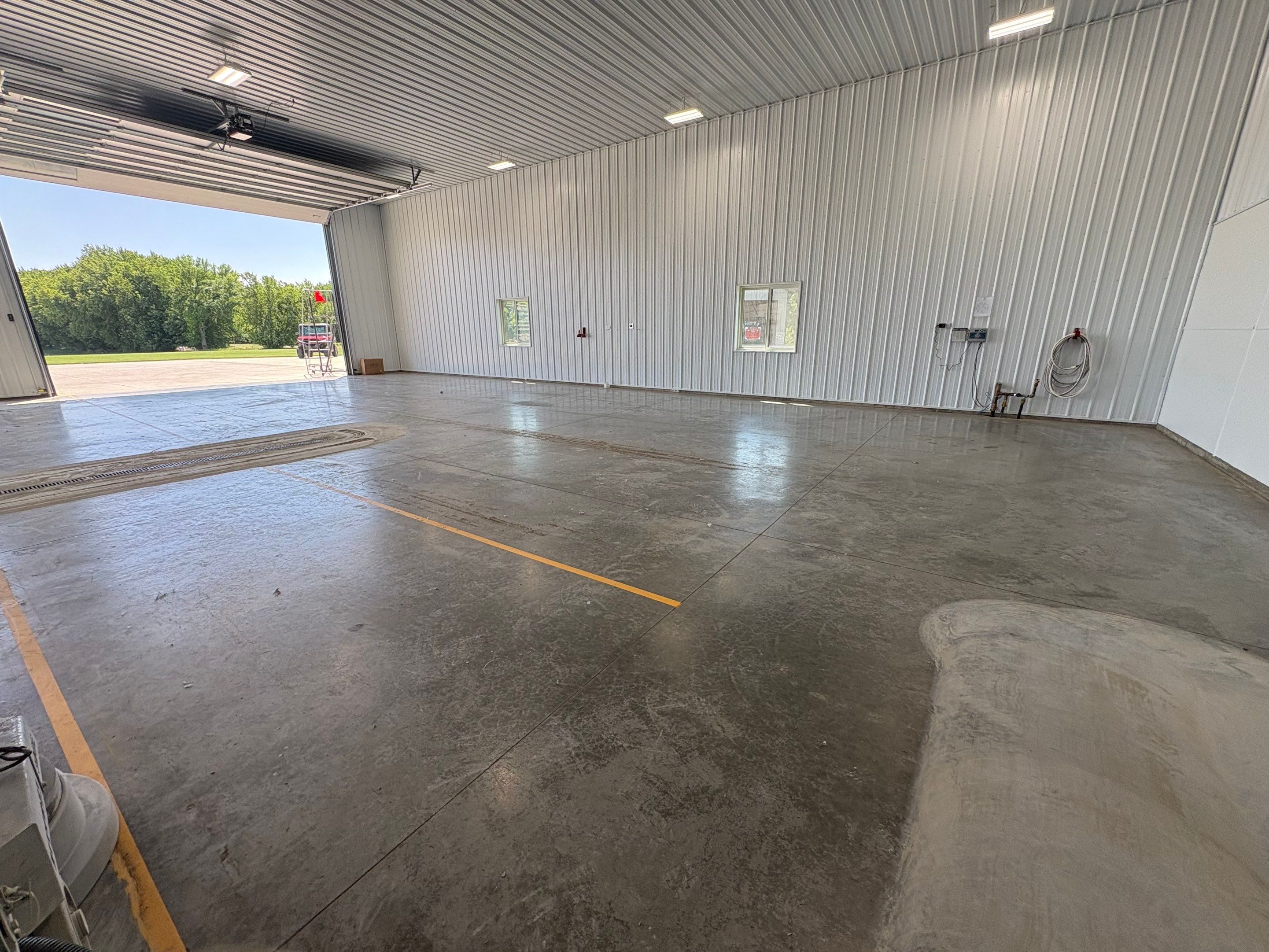 Multi-Stage Concrete Floor Coating for Egan Shop and RV Storage by Select Painting, Coatings & Garage Cabinets