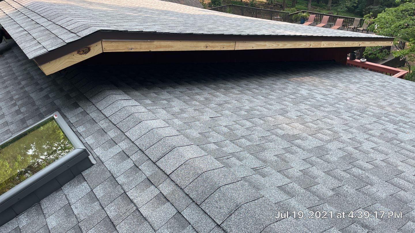 Deckhouse Roof Replacement by American Home Contractors