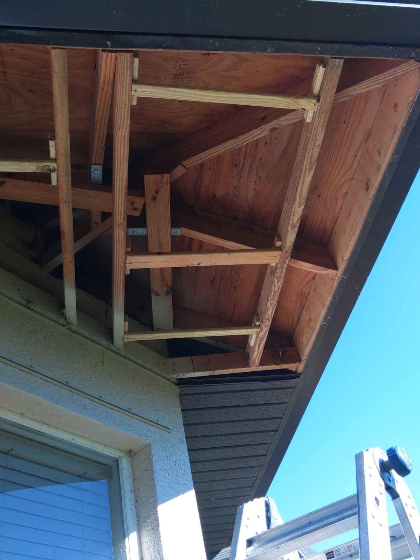 Dark Bronze Soffit Installation in Sarasota FL by Gutter Professors