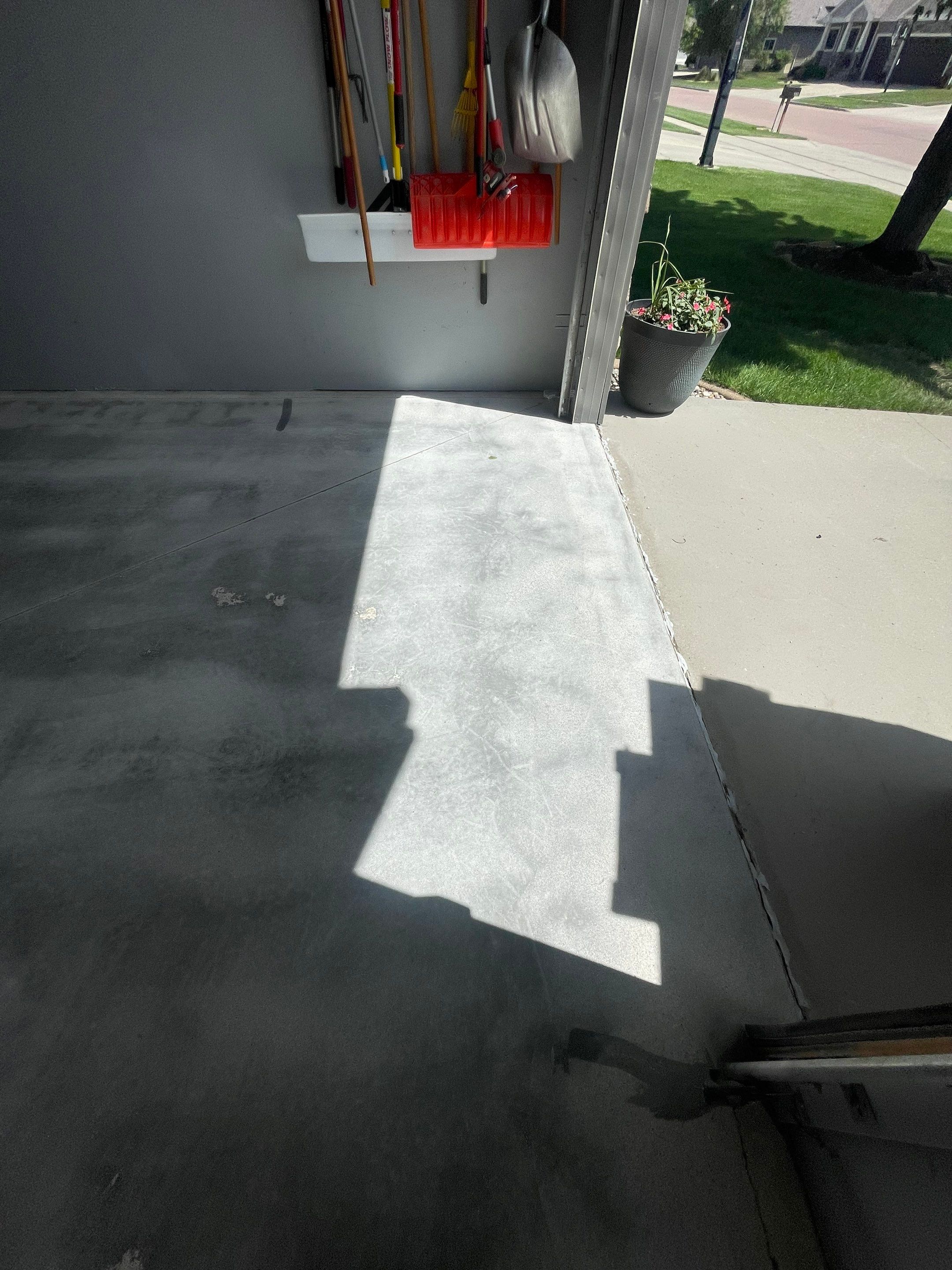 Full Garage Floor Epoxy Coating Installation in Dell Rapids by Select Painting, Coatings & Garage Cabinets