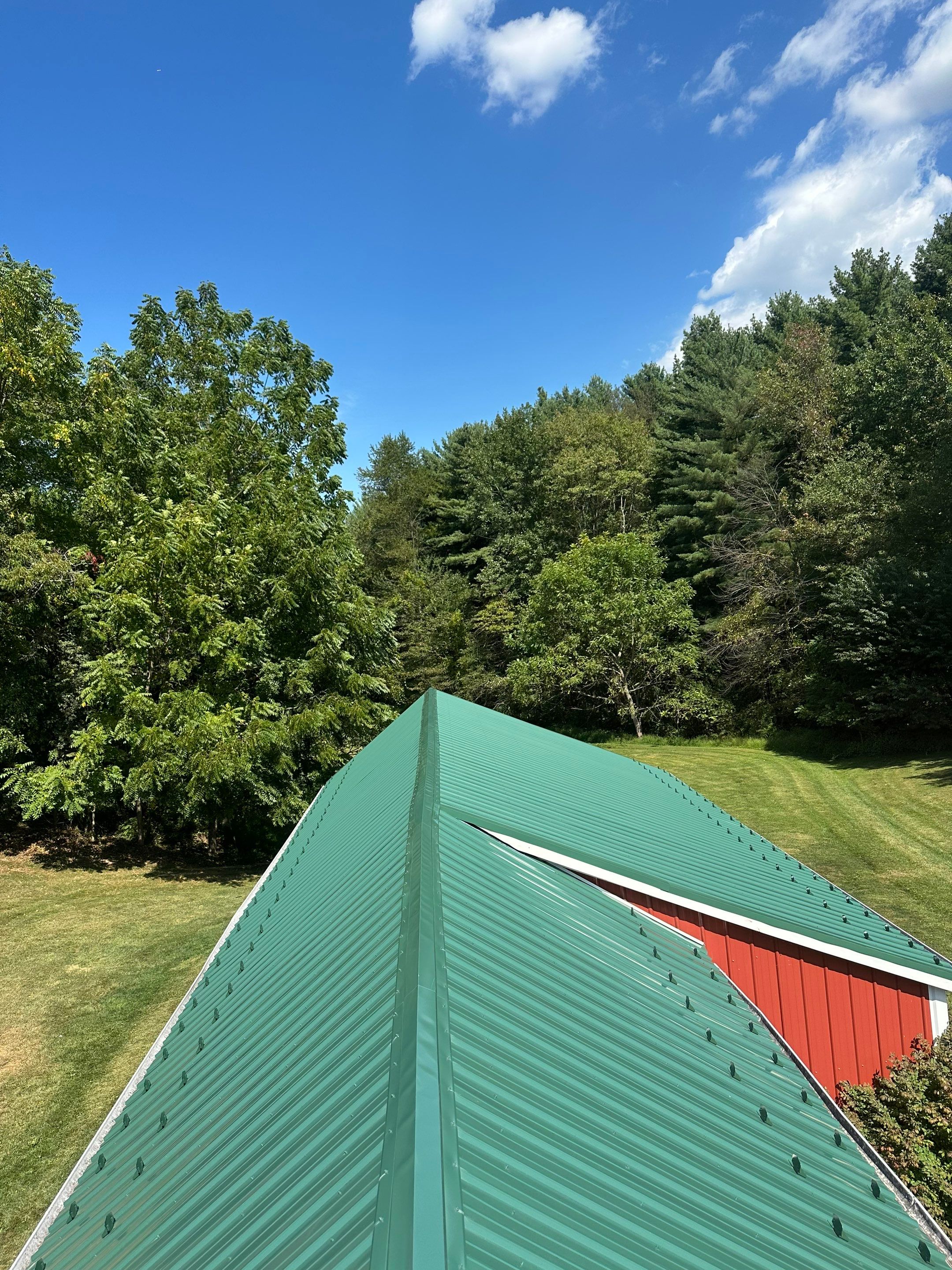 Stunning Metal Roof Transformation on a Classic Red Barn in New Freedom, PA by Bealing Roofing & Exteriors