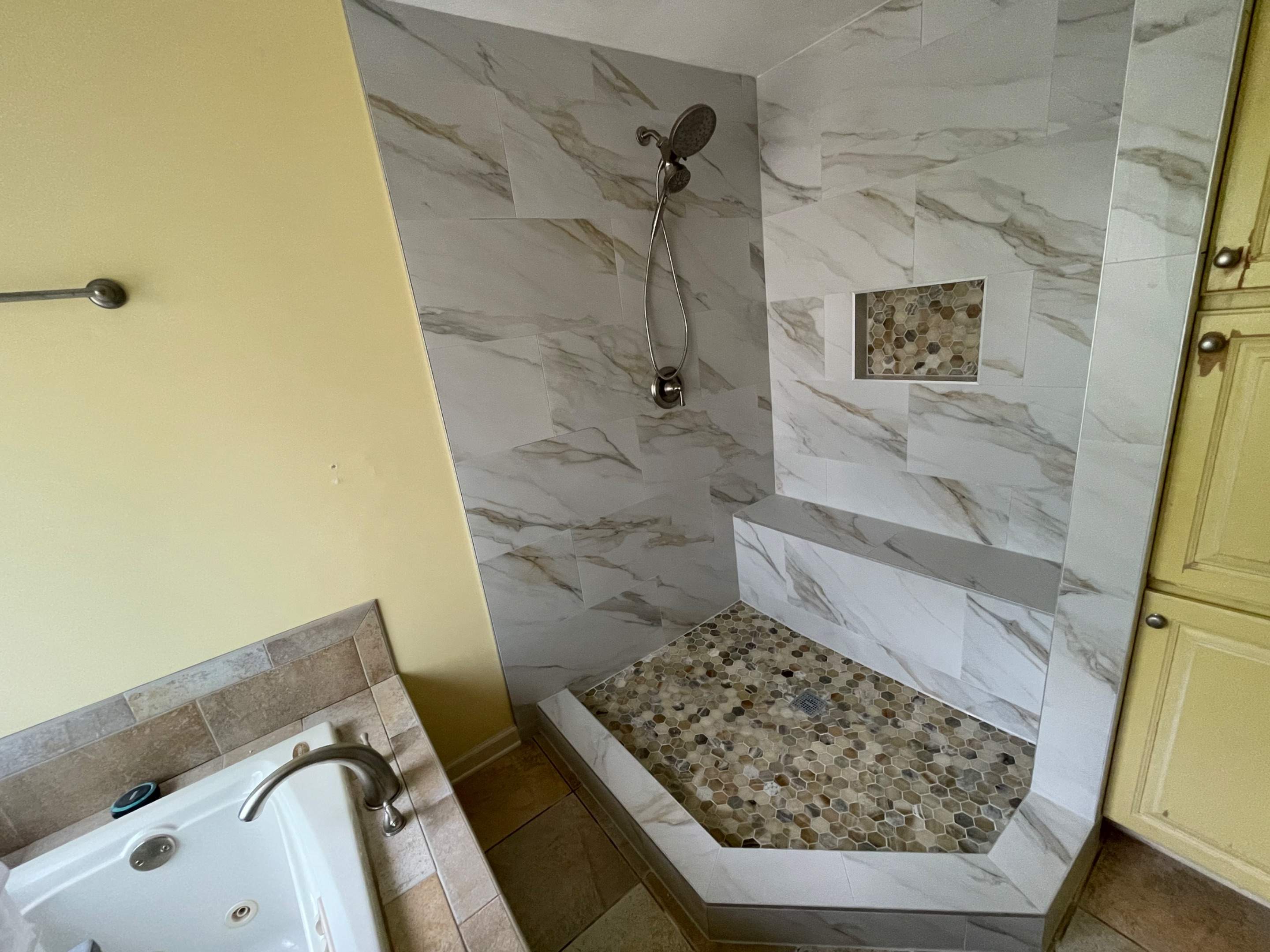 Master bathroom shower renovation, and tile flooring by Prudencio