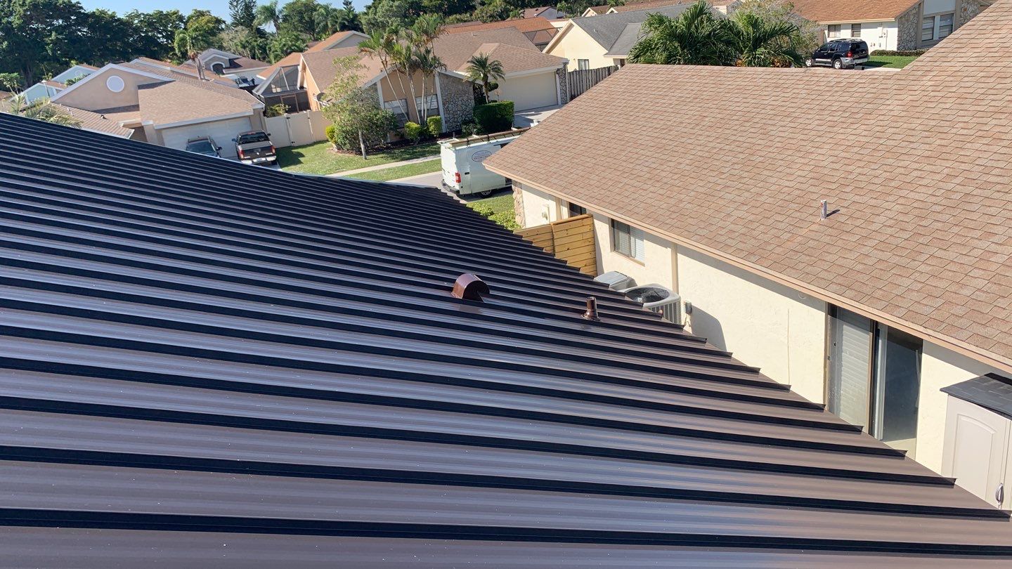 Residential Roofing Installation using 1" Nail strip metal roof by BLUES BROTHERS CONSTRUCTION CORP