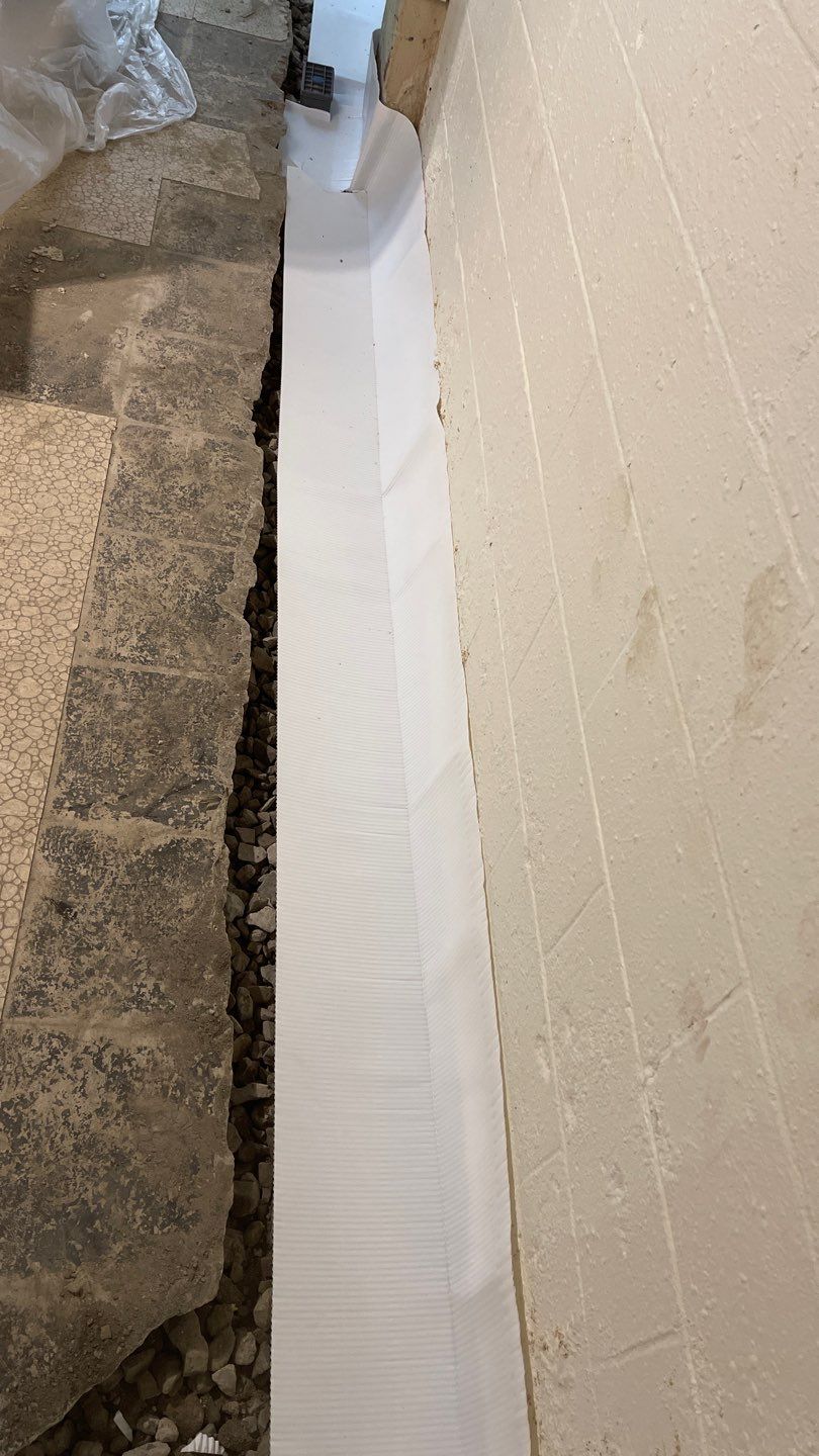 Interior Waterproofing Using GrateDrain™ Products by Toledo Basement Repair 