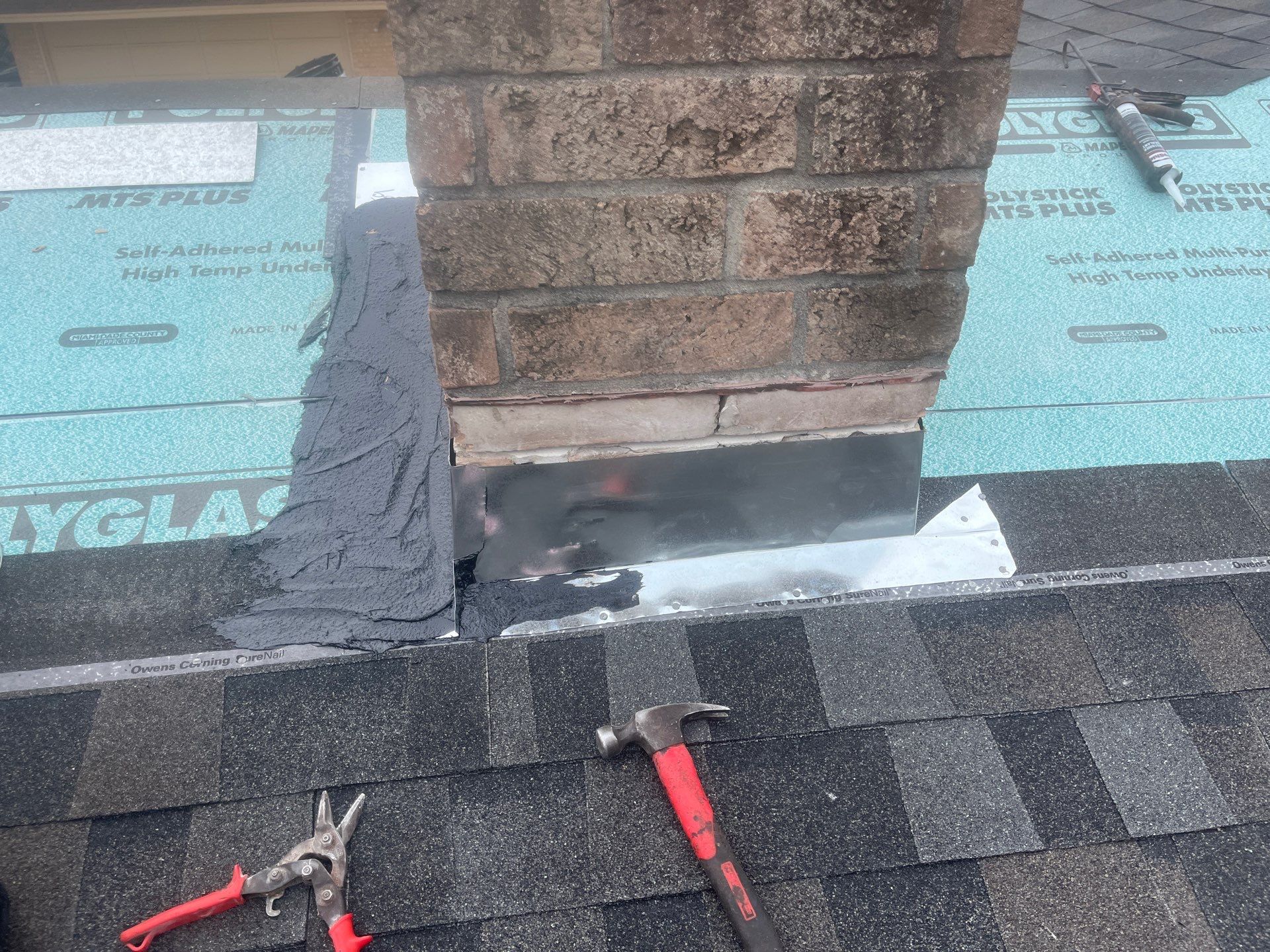 Colored Vinyl Windows to blend into brick by Bayfront Roofing and Construction