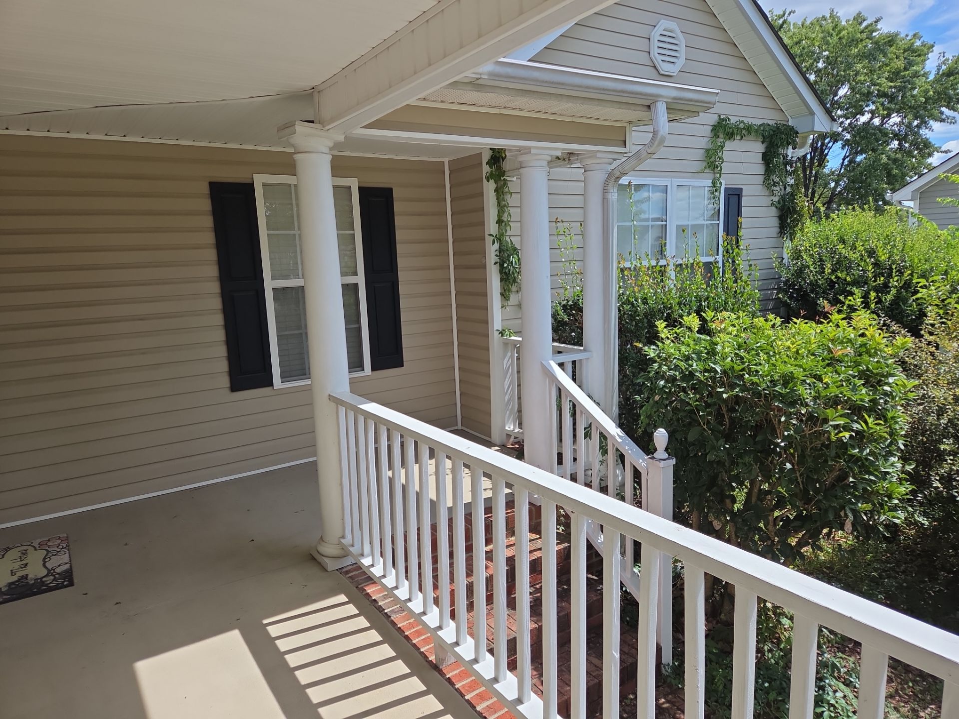 Custom Screened Porch Conversion with New Wood Railing in Dunn by The Remodeling Company