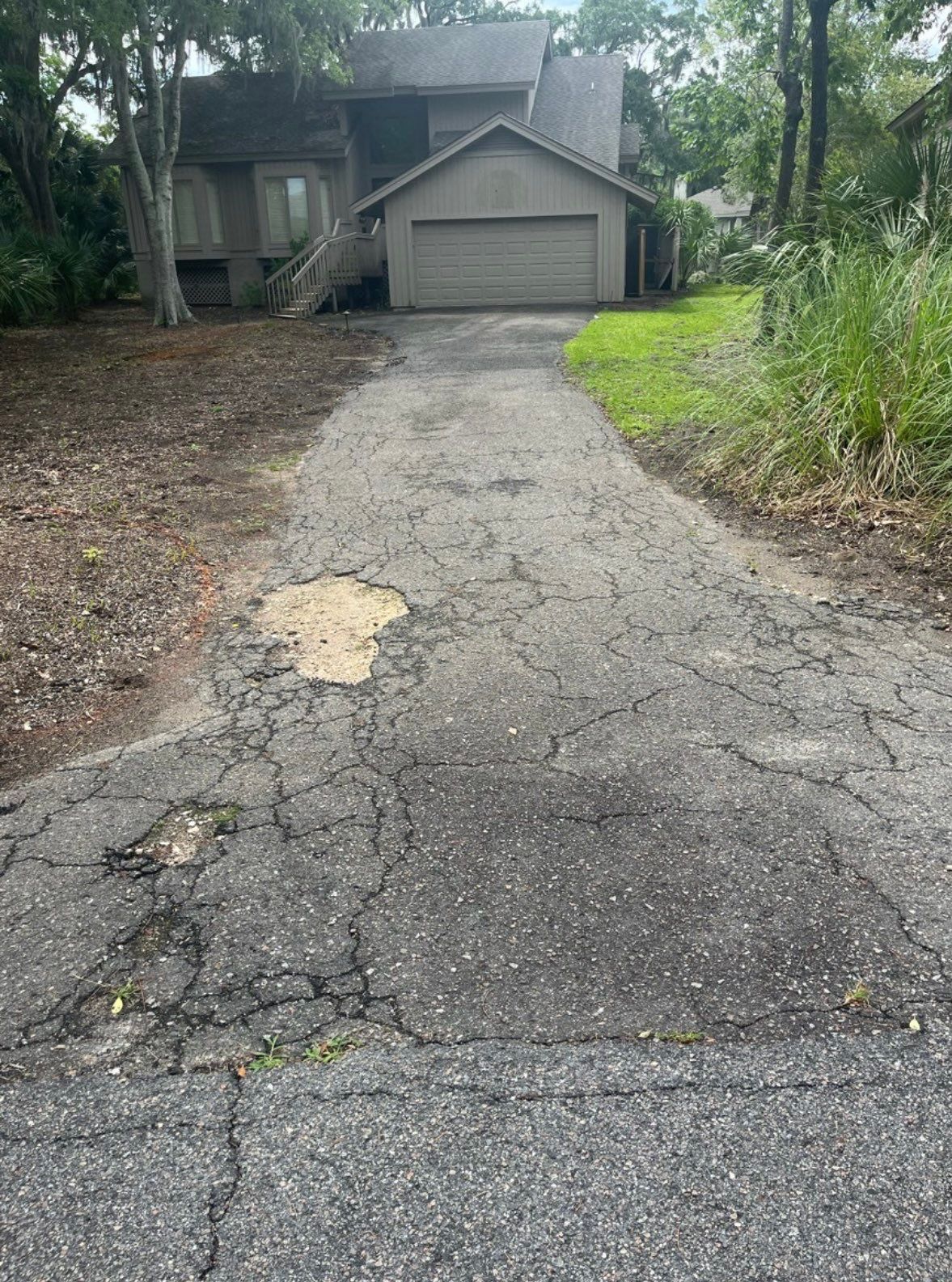 Concrete Driveway Replacement with Brick Paver Accents in Hilton Head Island by Lowcountry Scapes, LLC