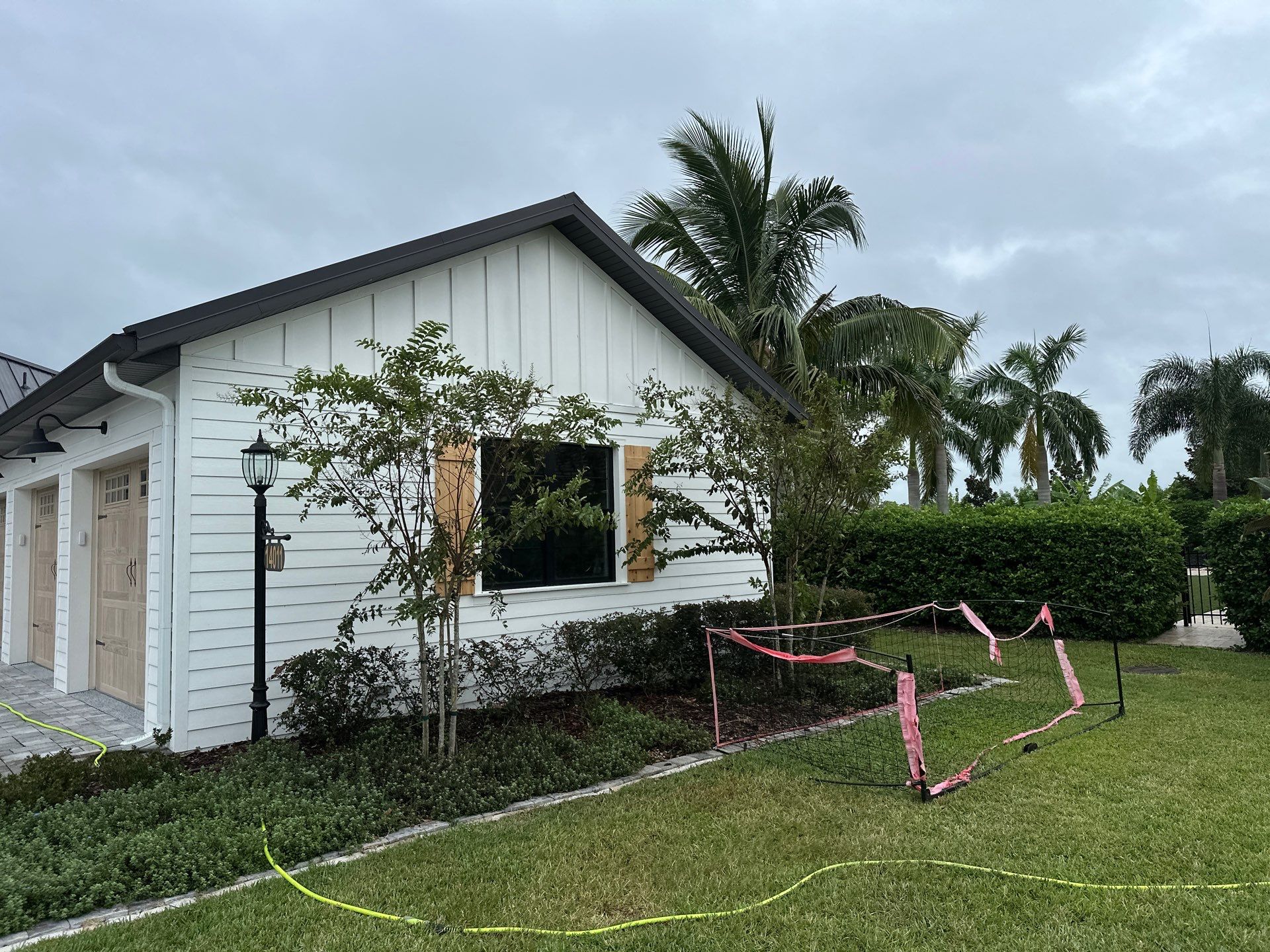 Complete Two-Story House Wash and Driveway Cleaning in Winding River Community, Bradenton, FL by Sunshine AquaWash
