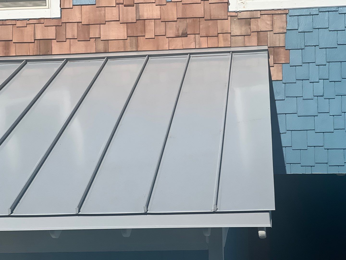 Large Metal Roof Transformation by Gallop Roofing & Remodeling, Inc.